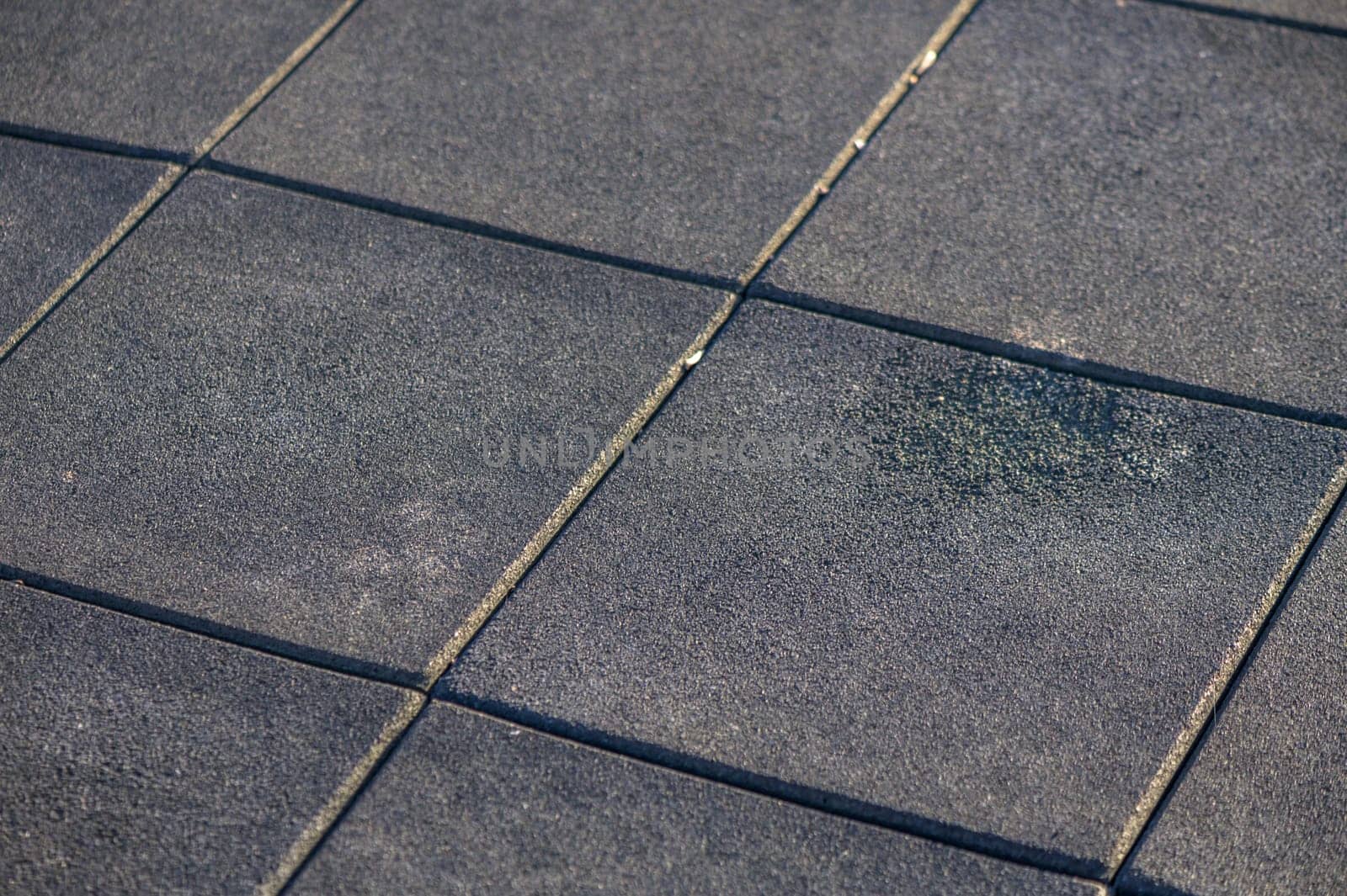 rubber soft covering with squares on the playground 10