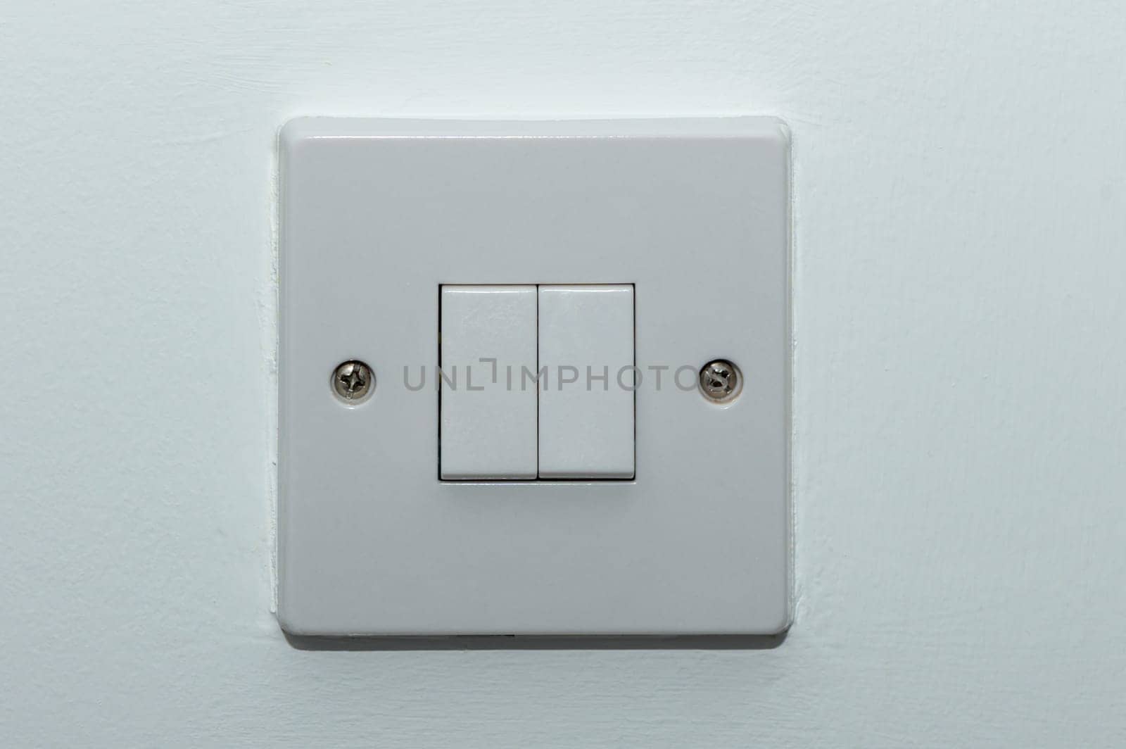 two button switch on a white wall