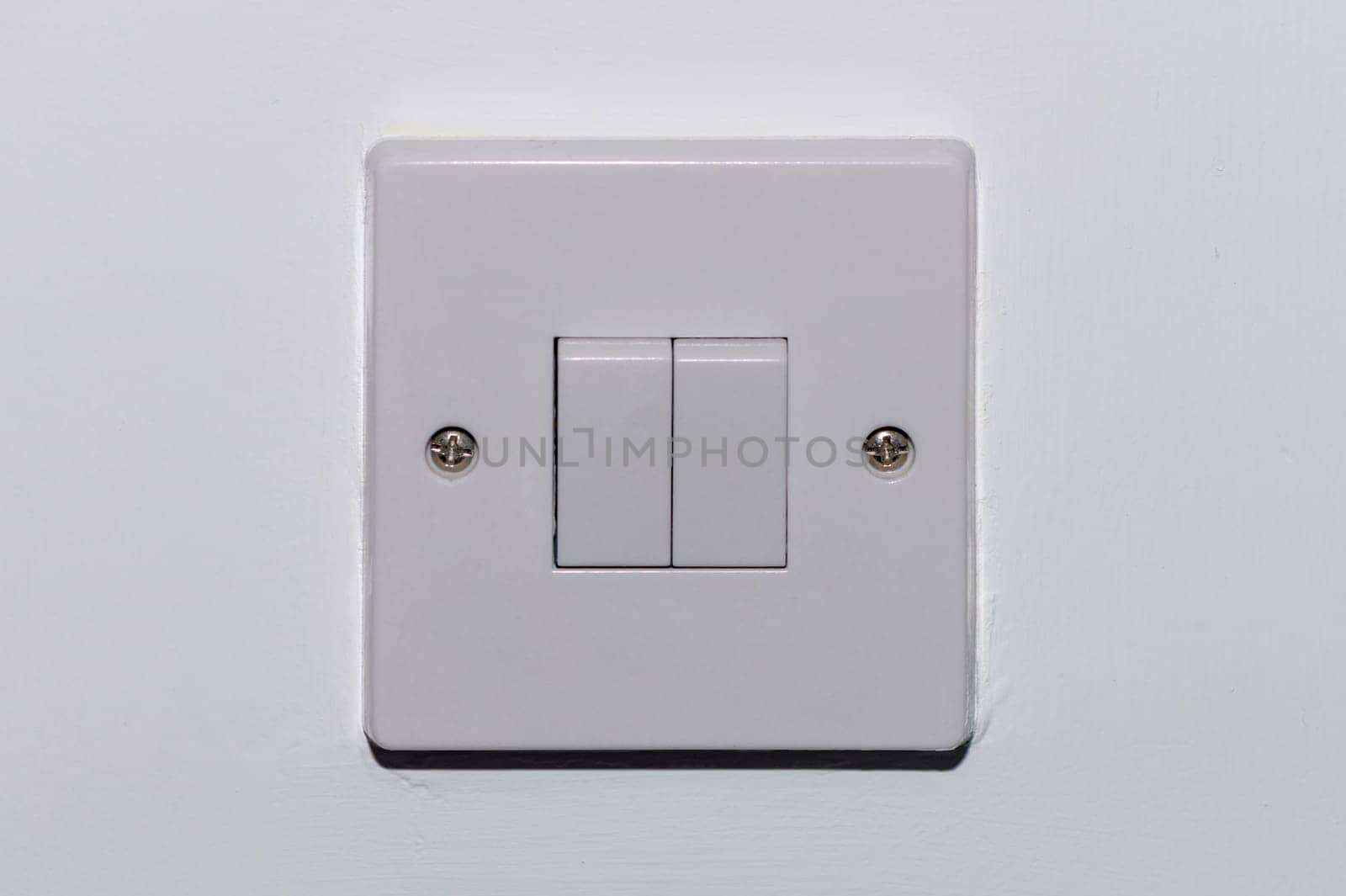 two button switch on a white wall 1