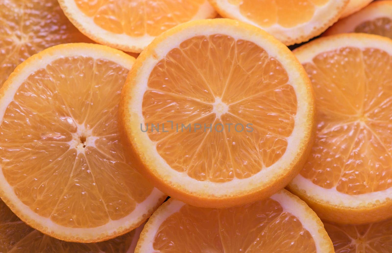 oranges cut into slices and laid out on the table as a food background 4