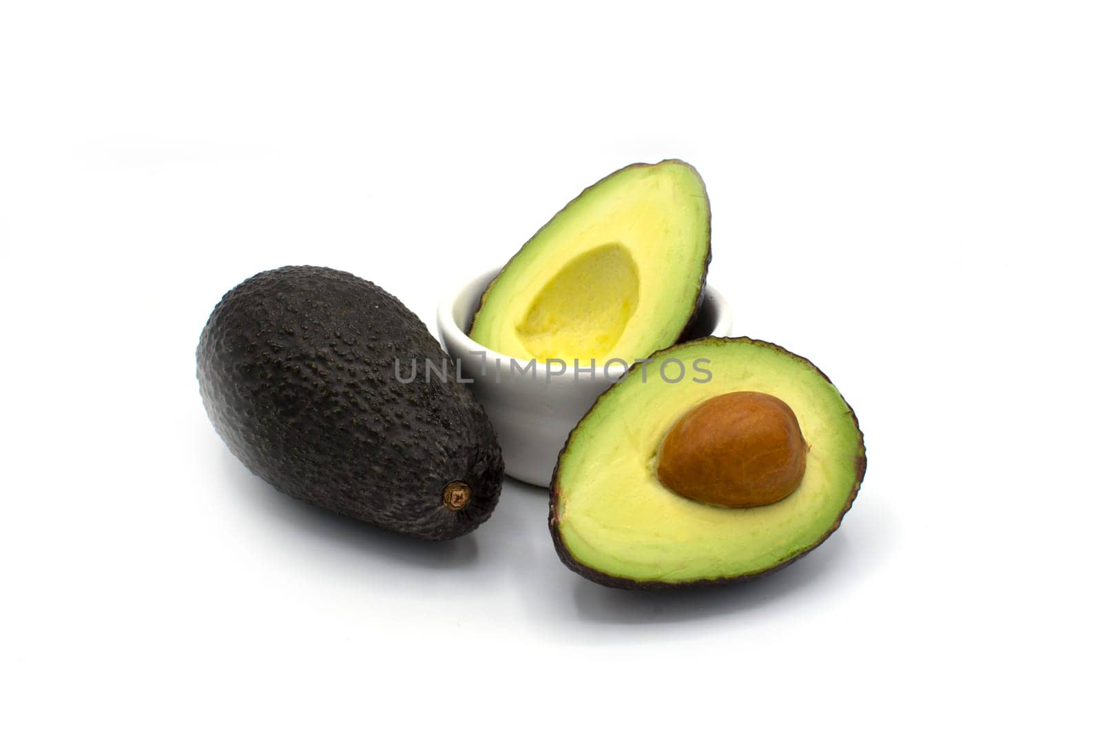 Fresh and healthy Avocado cut in half isolated