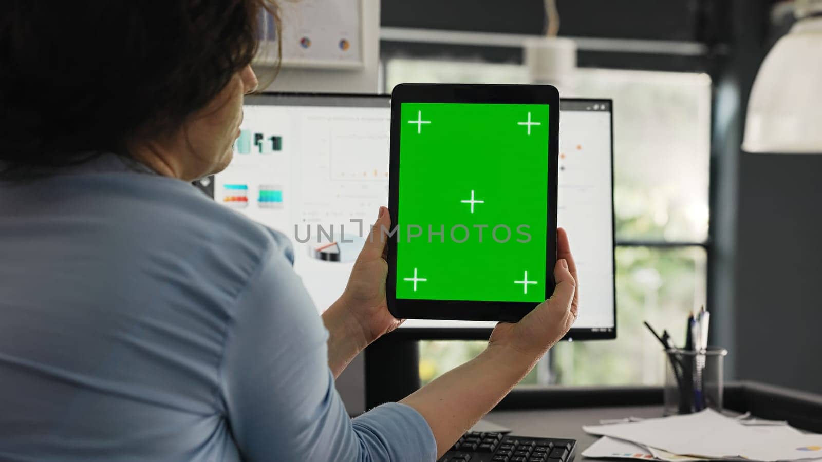 Office worker examine greenscreen layout by DCStudio