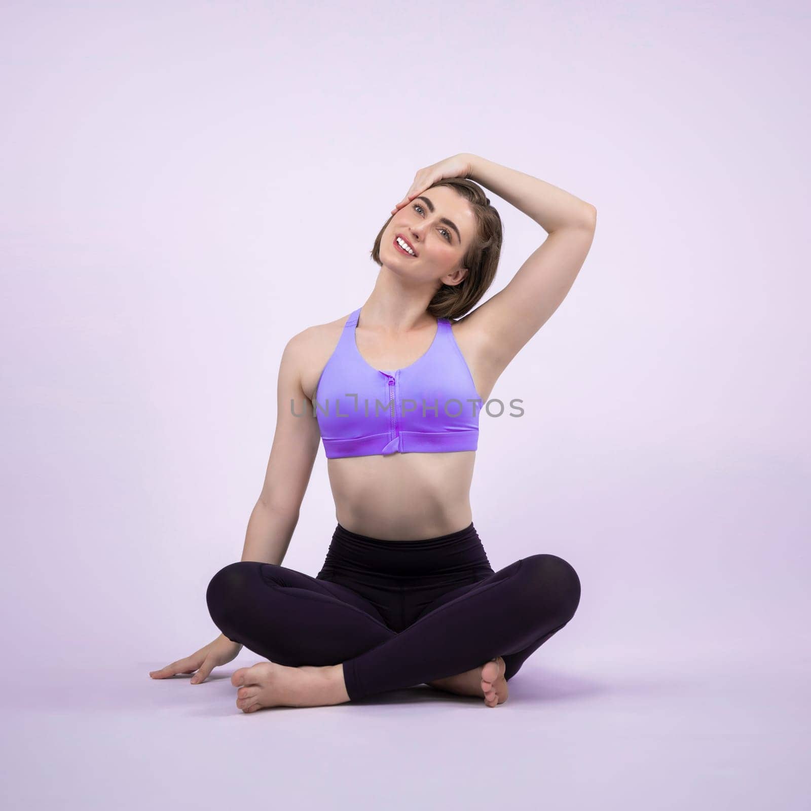 Full body length gaiety shot athletic and sporty woman doing yoga by biancoblue