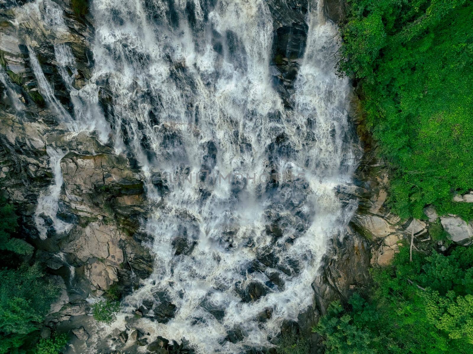 Aerial view waterfall in lush tropical green forest. Nature landscape. Mae Ya Waterfall is situated in Doi Inthanon National Park, Chiang Mai, Thailand. Waterfall flows through jungle on mountainside. by Fahroni