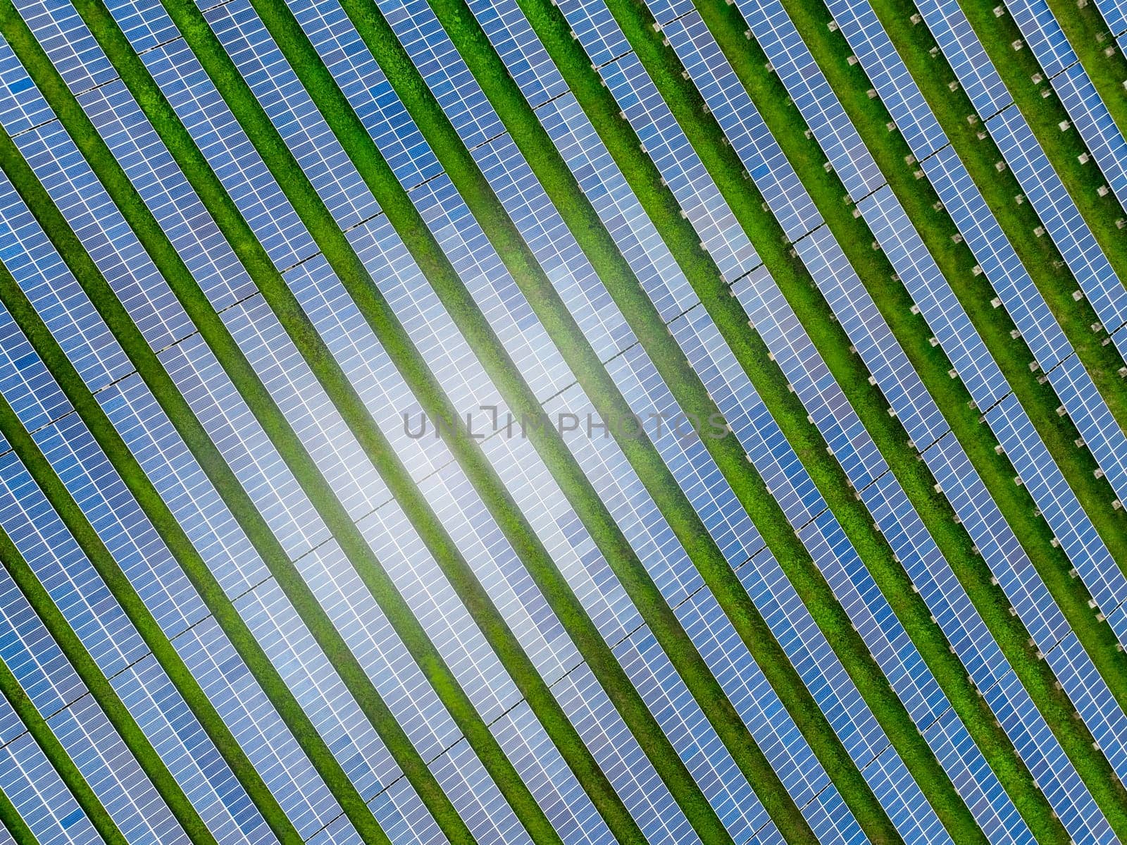 Solar farm and sun light. Solar power for green energy. Sustainable renewable energy. Photovoltaic power station or solar park. Solar panel installation and maintenance concept. Energy sustainability.