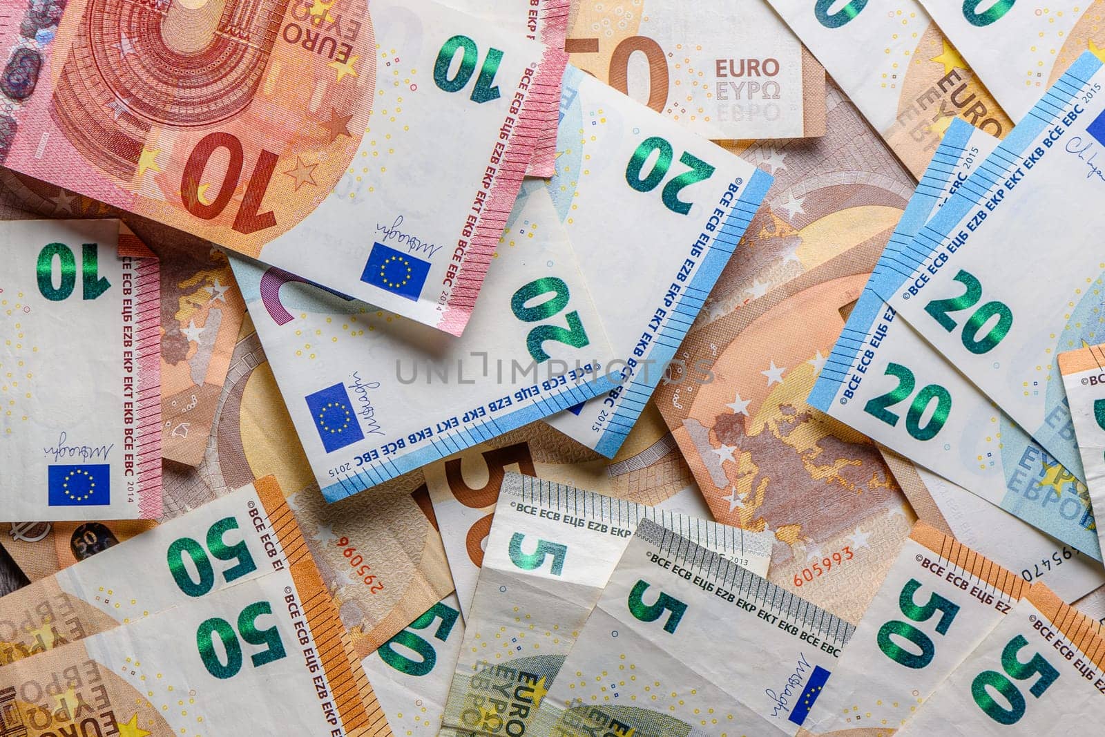 euro bills scattered on the table as a background 17