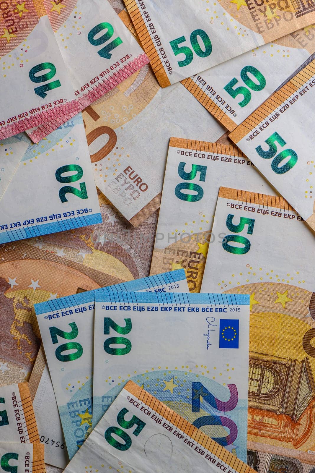 euro bills scattered on the table as a background 16 by Mixa74