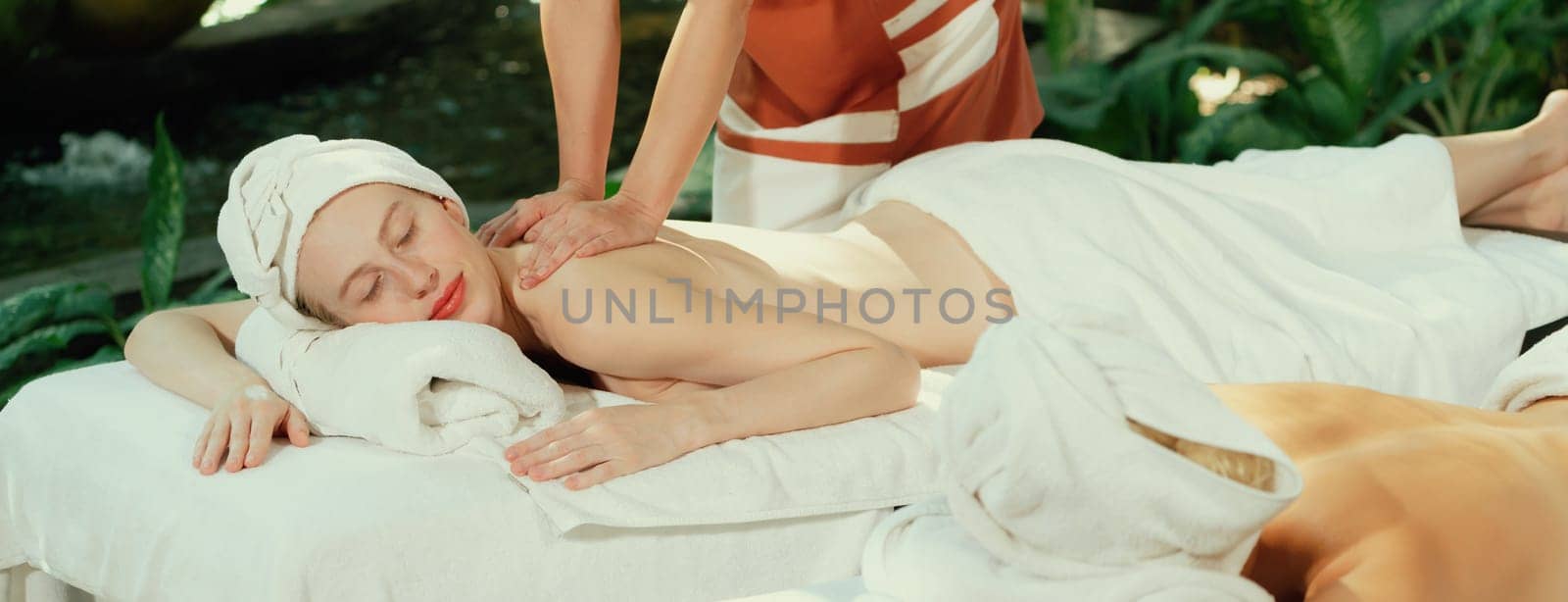 Couple of beautiful woman having back massage at peaceful spa room. Tranquility. by biancoblue