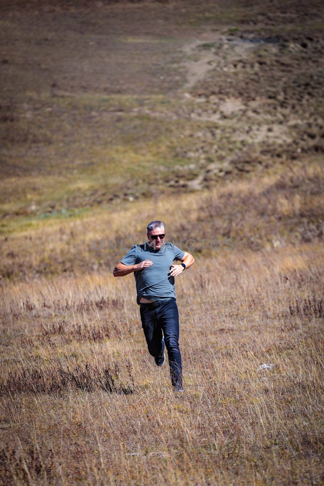 A man runs down the mountain by Yurich32