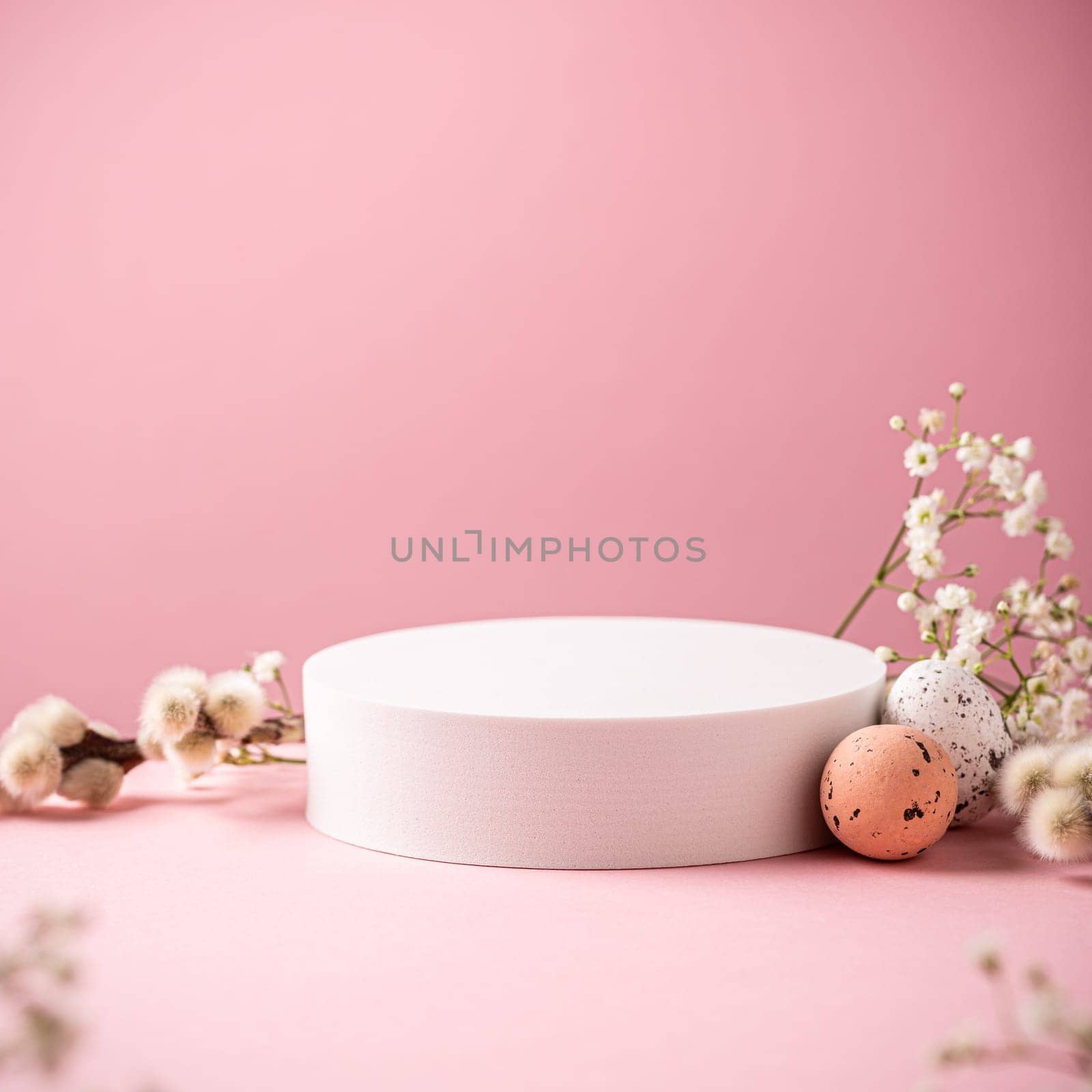 White podium with Easter quail eggs by IrynaMelnyk
