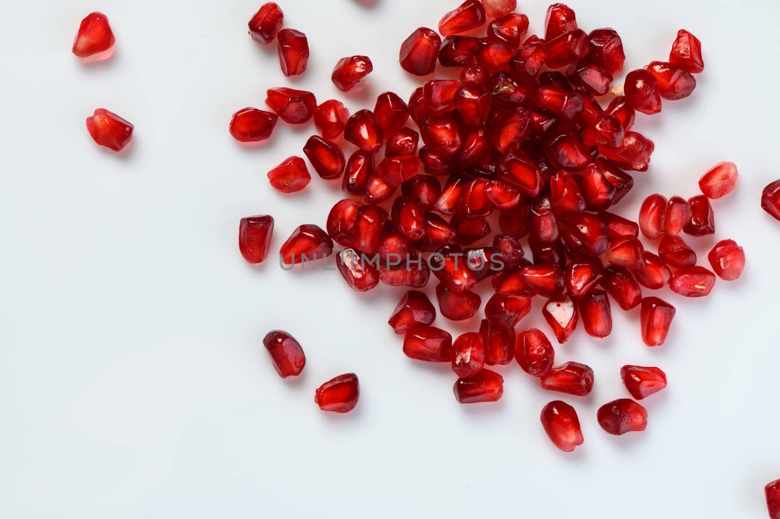 juicy pomegranate seeds on white background 5