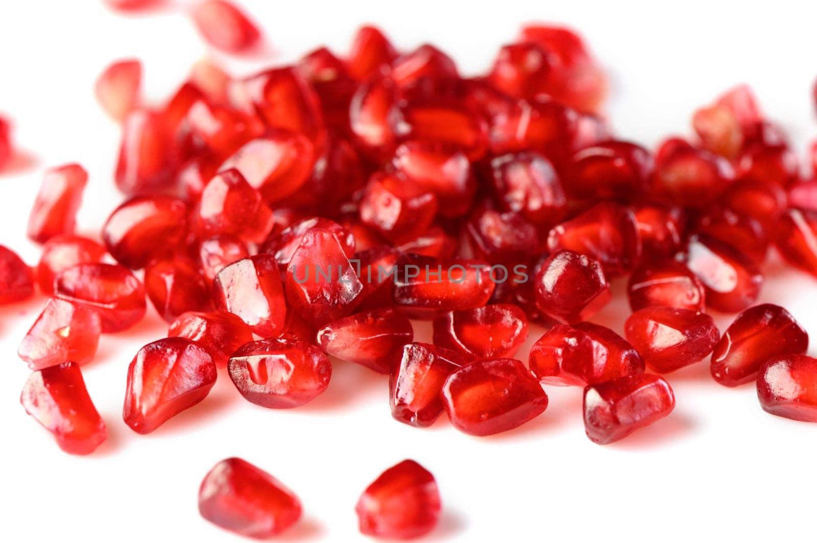 juicy pomegranate seeds on white background 2