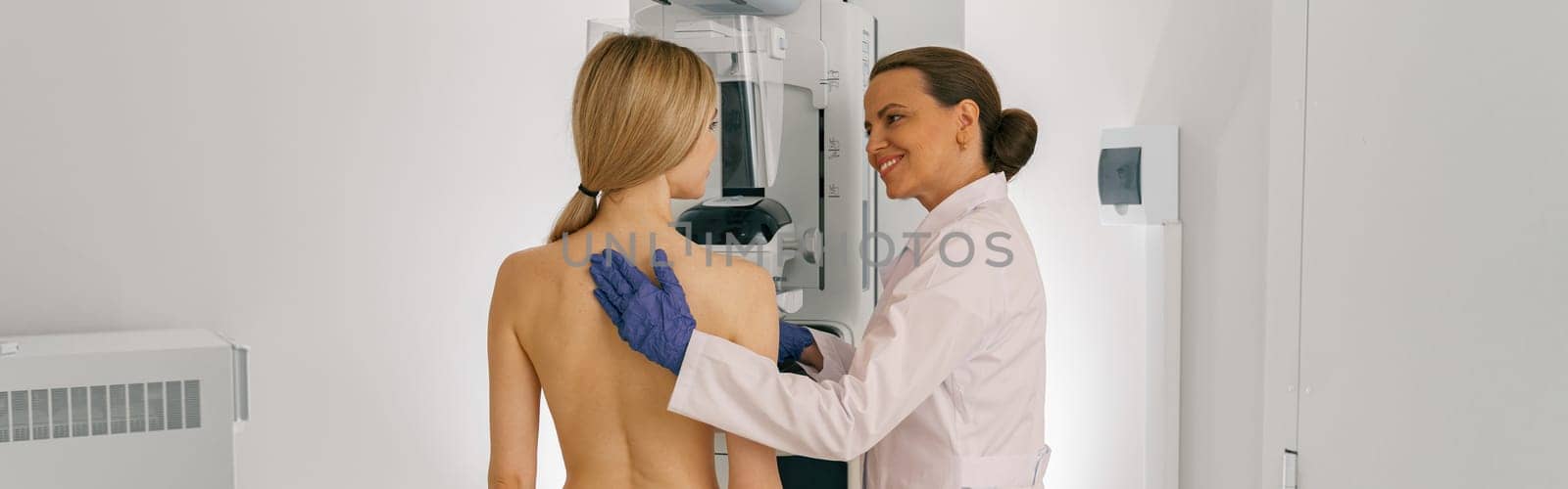 Woman doing mammogram x ray for breast cancer prevention screening at hospital