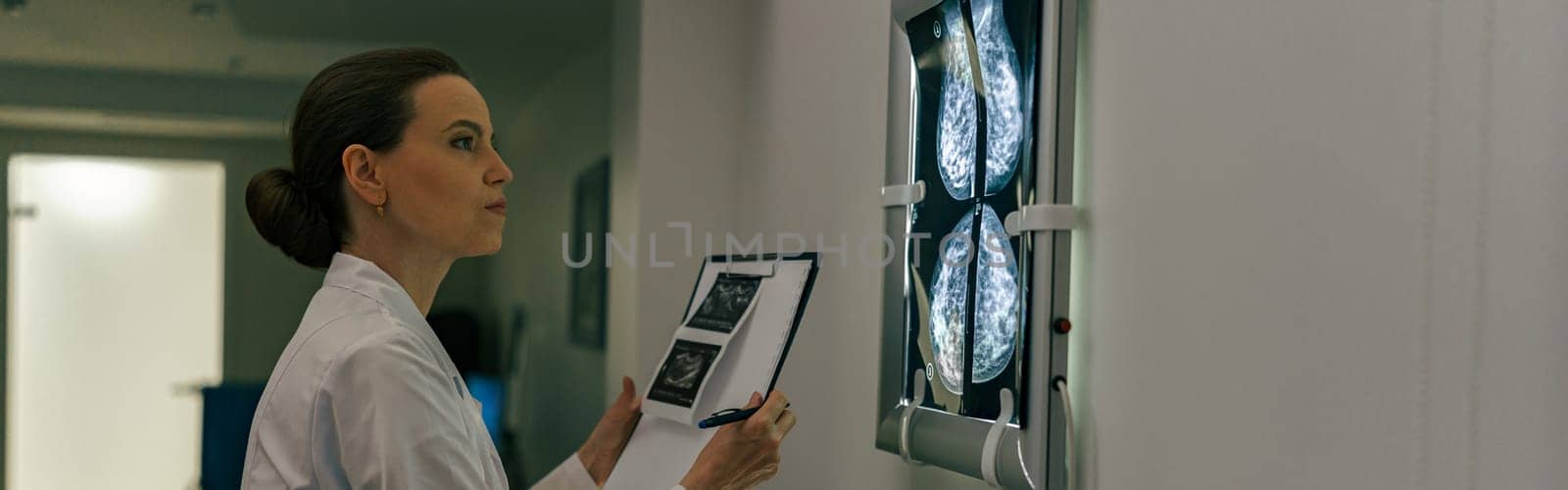 Female doctor neuroscientist analyzing scan MRI images in hospital. High quality photo
