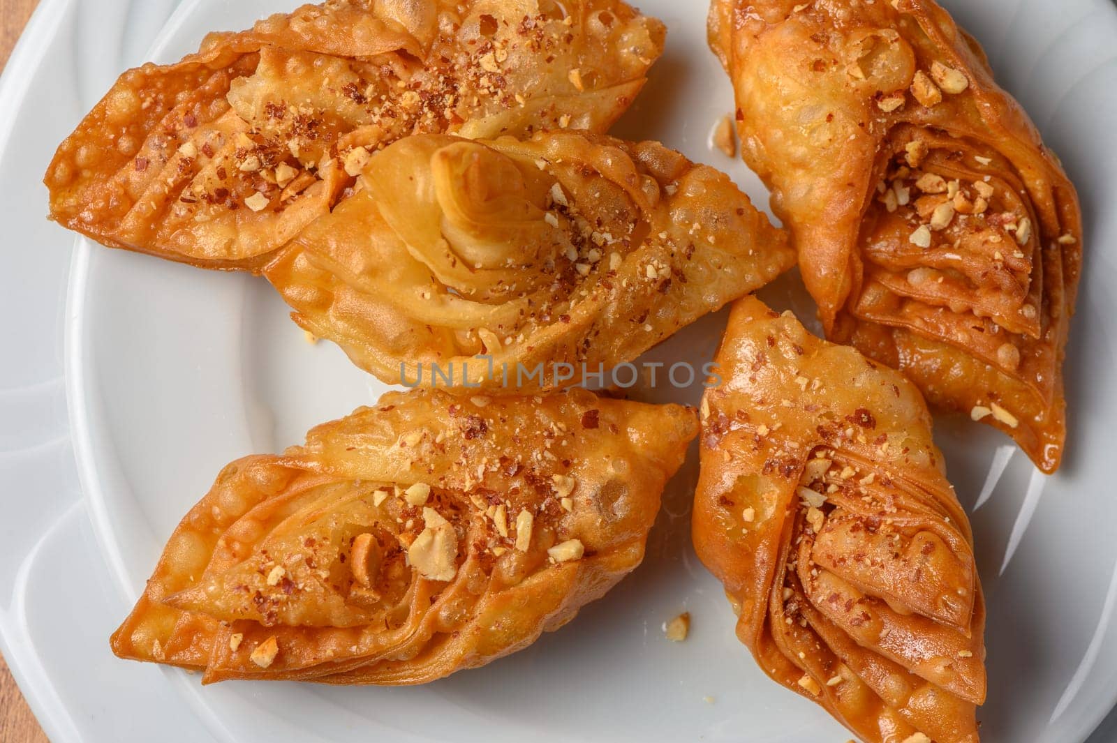 Turkish baklava, sweet dessert with honey on a light plate 17