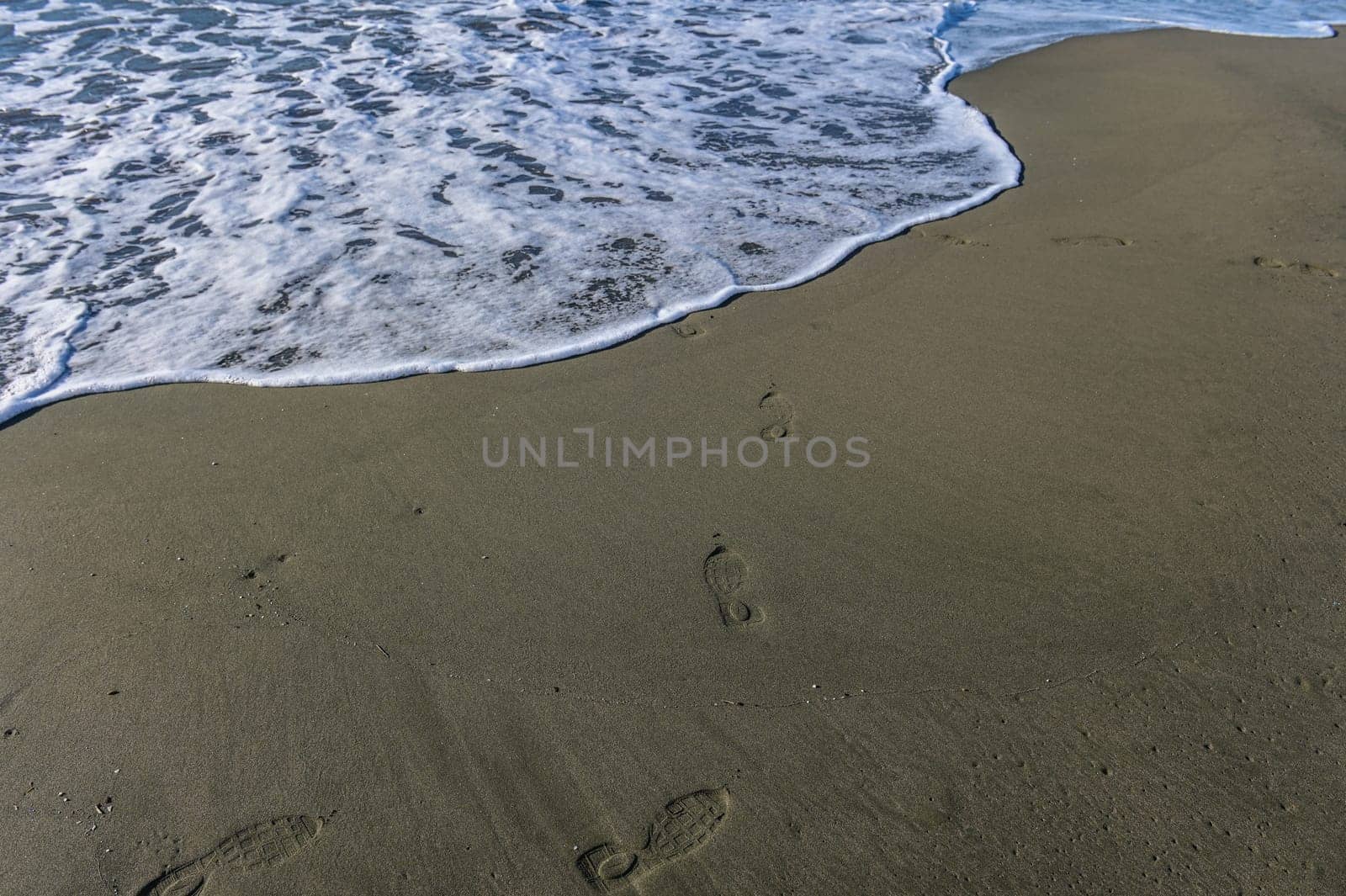 footprints of a woman on the beach of the Mediterranean Sea 1 by Mixa74