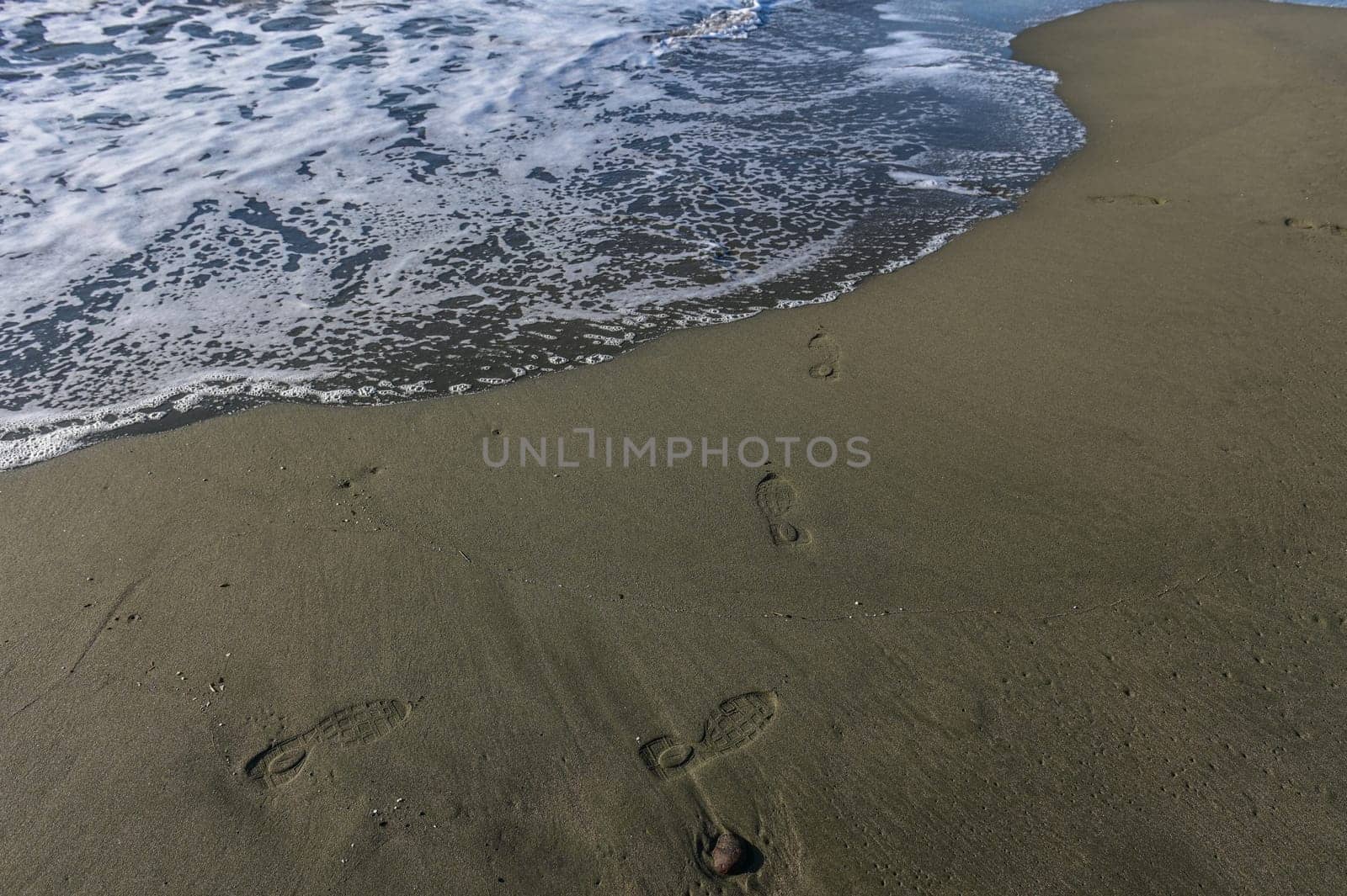 footprints of a woman on the beach of the Mediterranean Sea2 by Mixa74