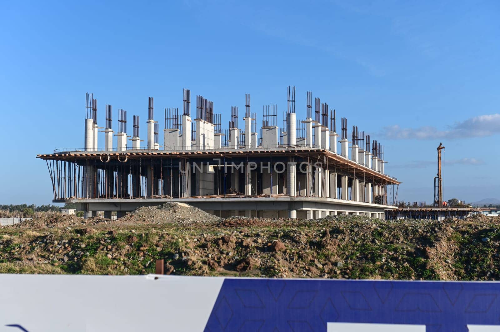 machine for pouring concrete at the construction site of a new complex near the sea 8