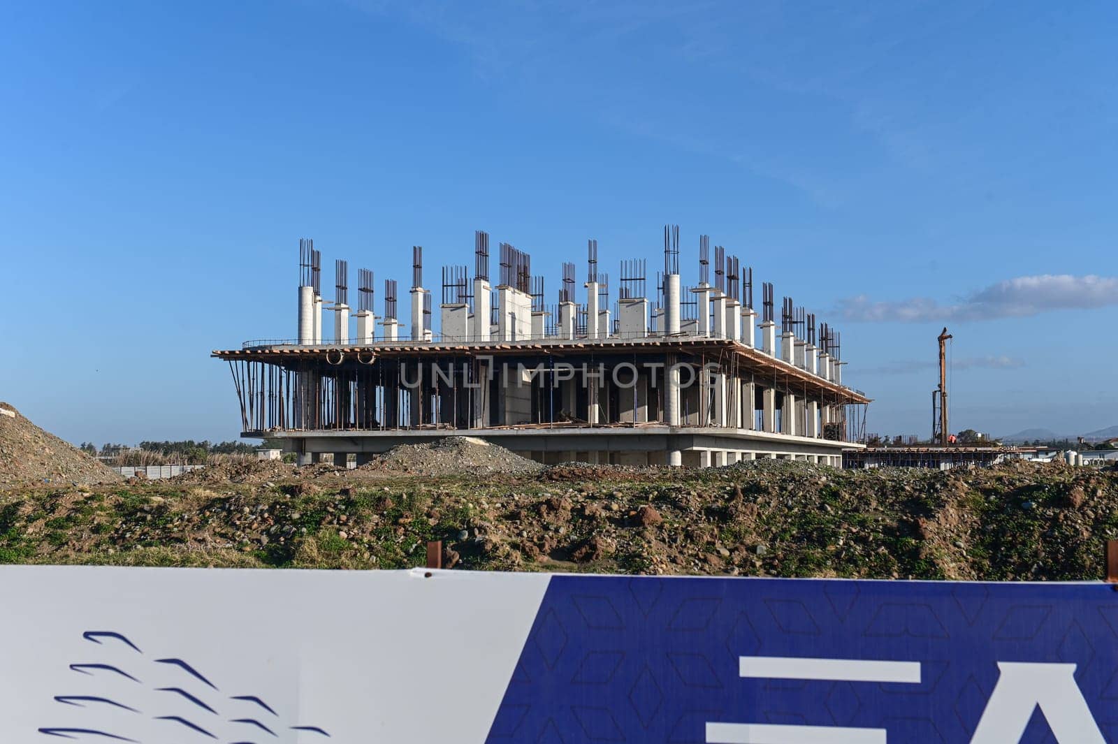 machine for pouring concrete at the construction site of a new complex near the sea 7