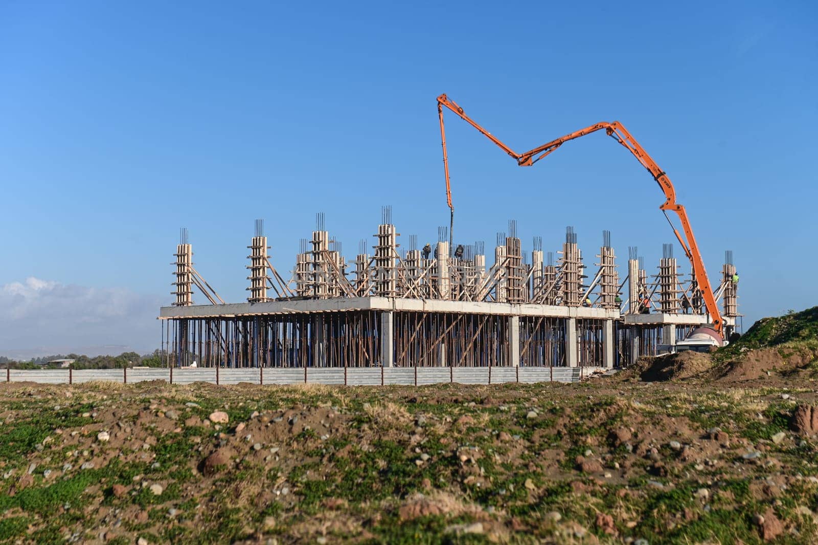machine for pouring concrete at the construction site of a new complex near the sea 6