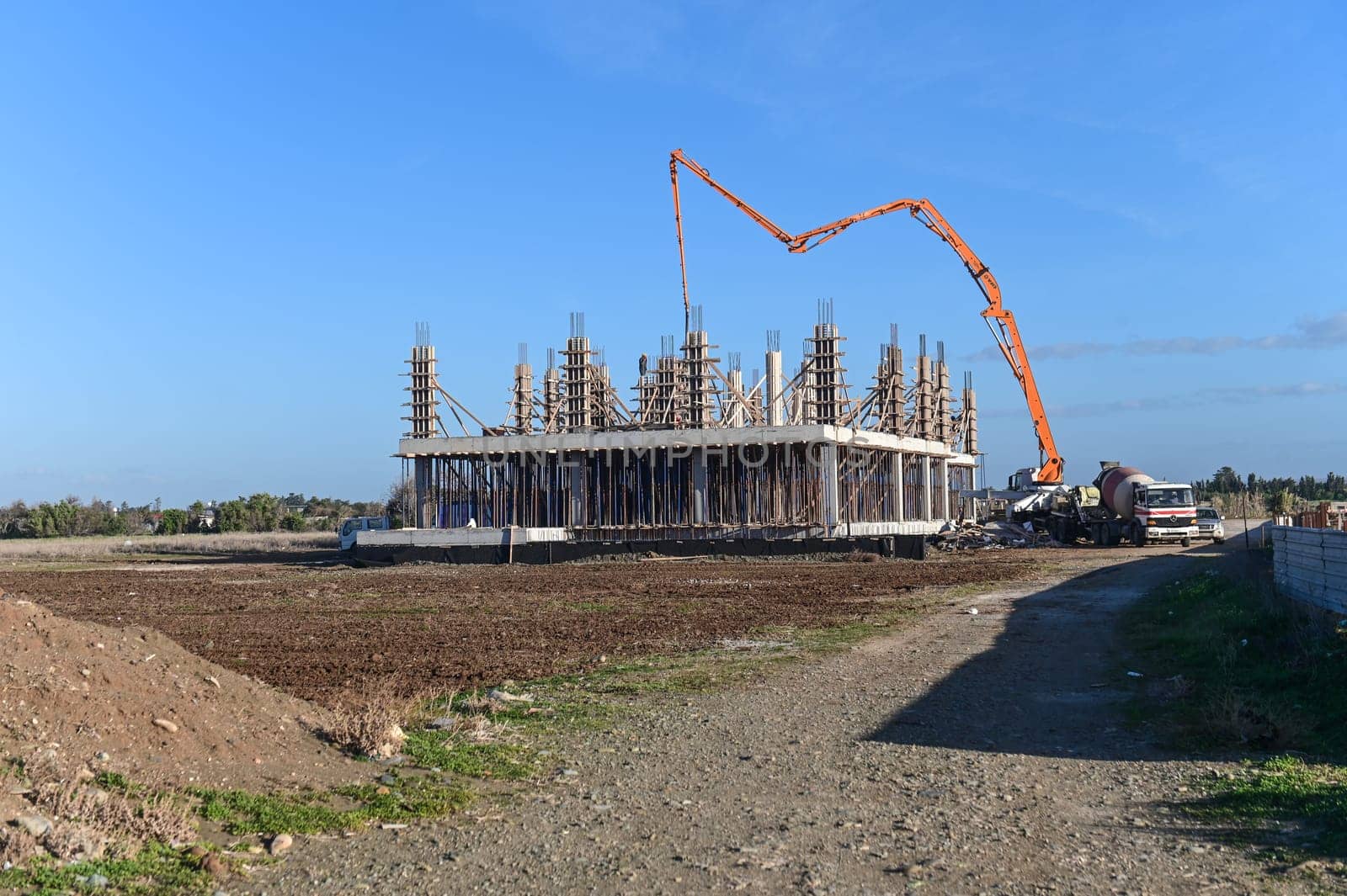 machine for pouring concrete at the construction site of a new complex near the sea 2