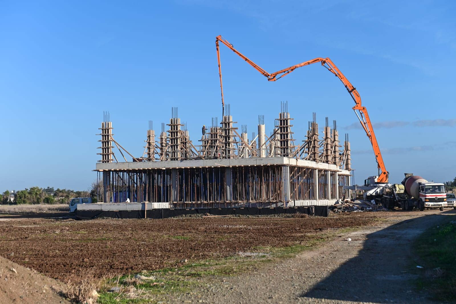 machine for pouring concrete at the construction site of a new complex near the sea 1