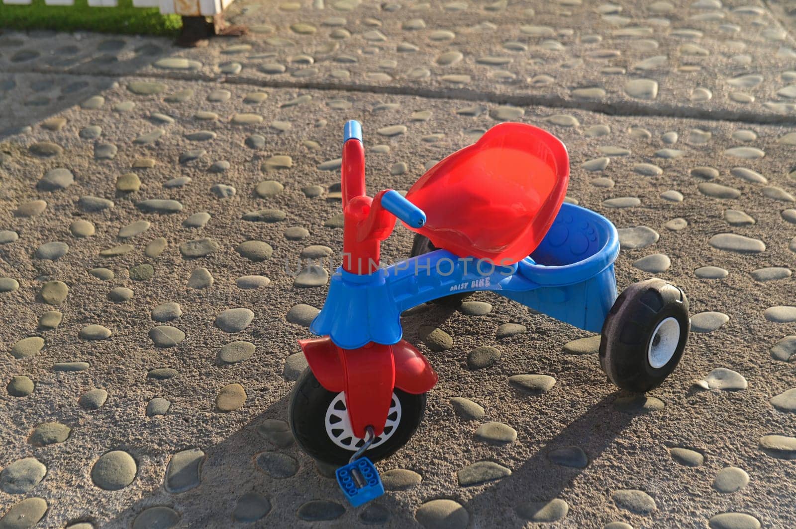 children's car on the playground near the sea