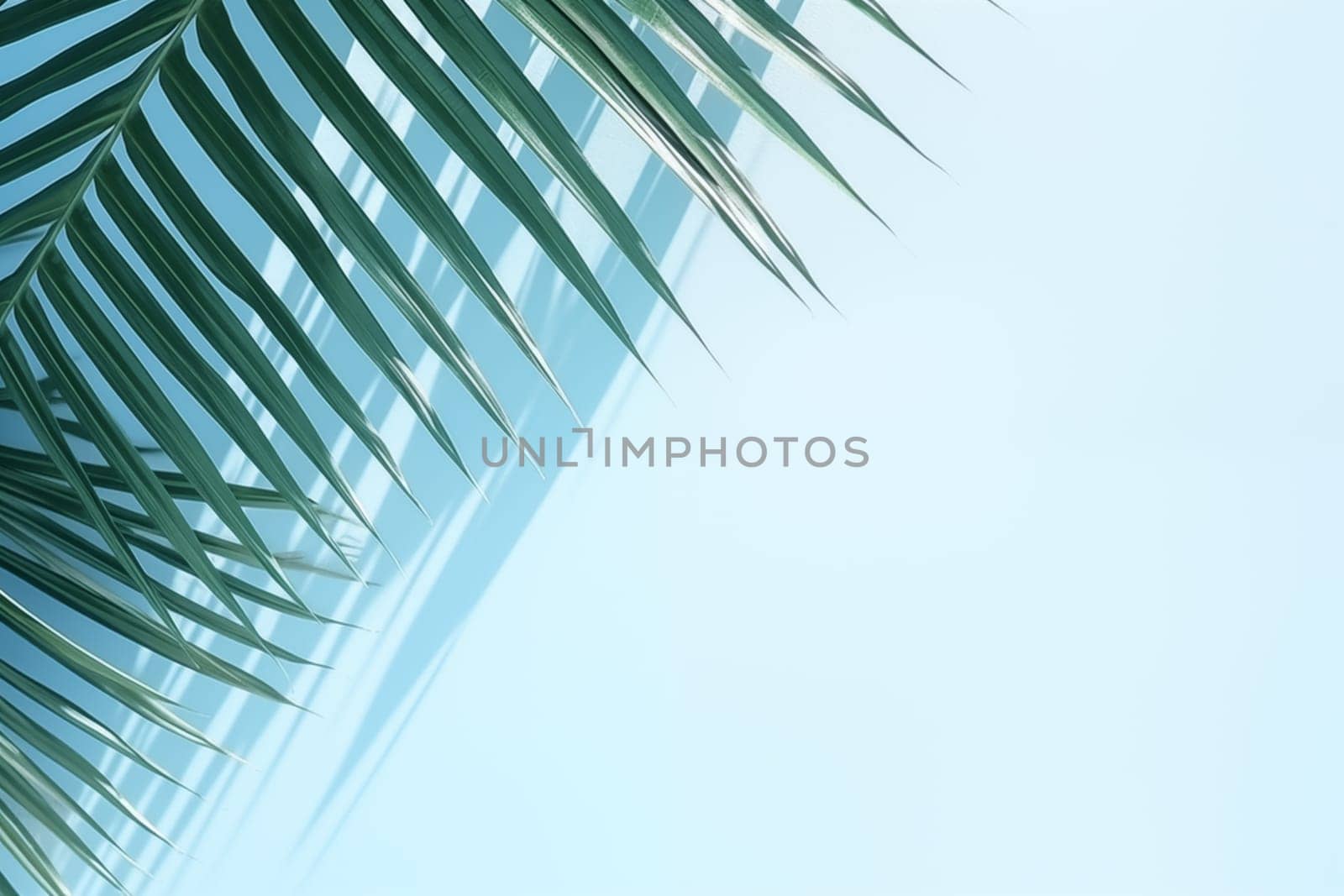 Blurred shadow from palm leaves on the light blue wall. Minimal abstract background for product presentation. Spring and summer. High quality photo