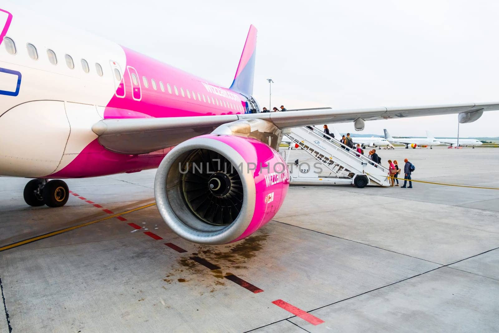 Close up turbine of WIzzair aircraft in airport by vladimka
