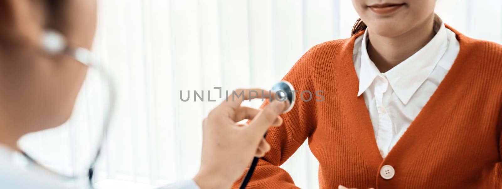 Doctor check patients's pulse with stethoscope in hospital. Rigid by biancoblue