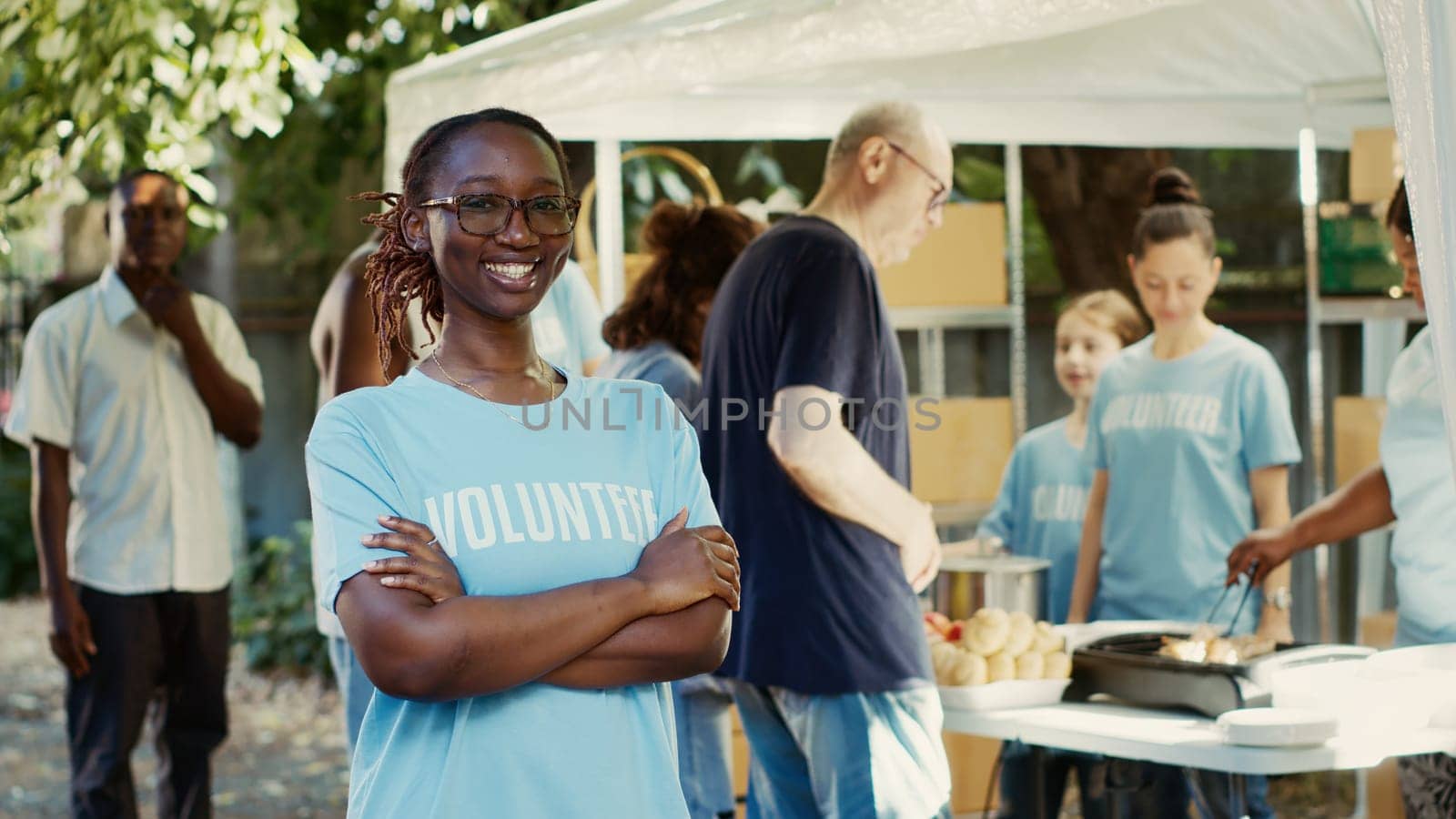 Woman with glasses at a non-profit event by DCStudio