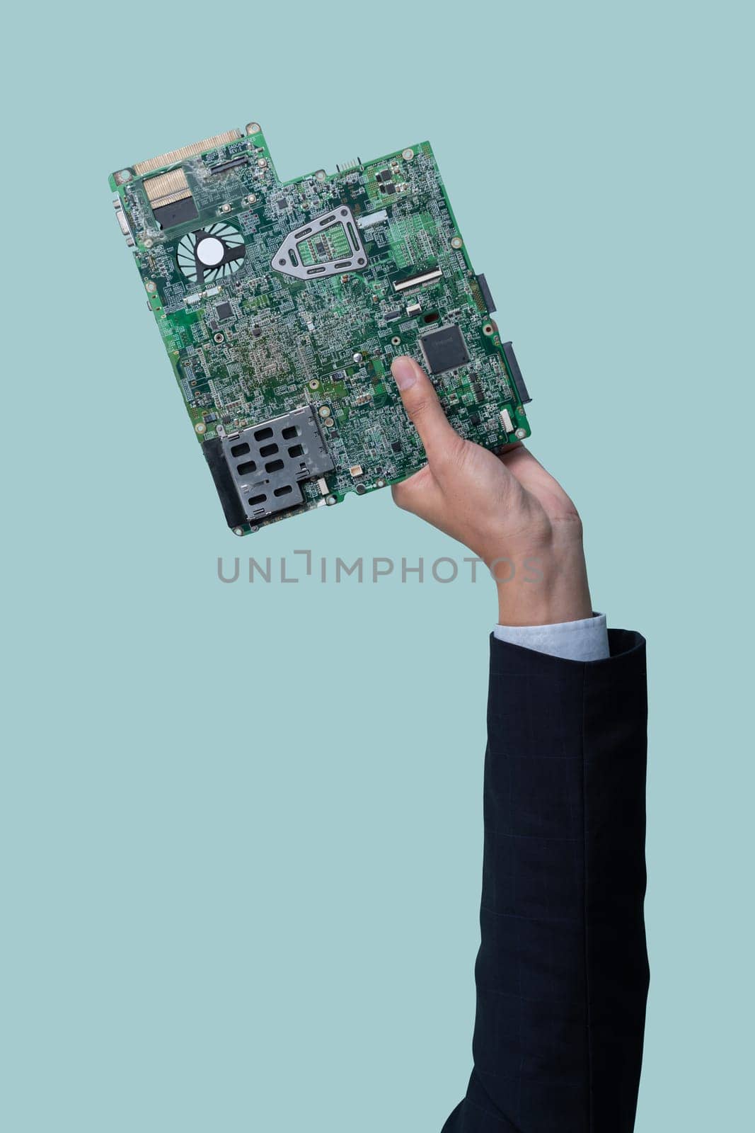 Businessman's hand holding electronic waste on isolated background. Eco-business recycle waste policy in corporate responsibility. Reuse, reduce and recycle for sustainability environment. Quaint