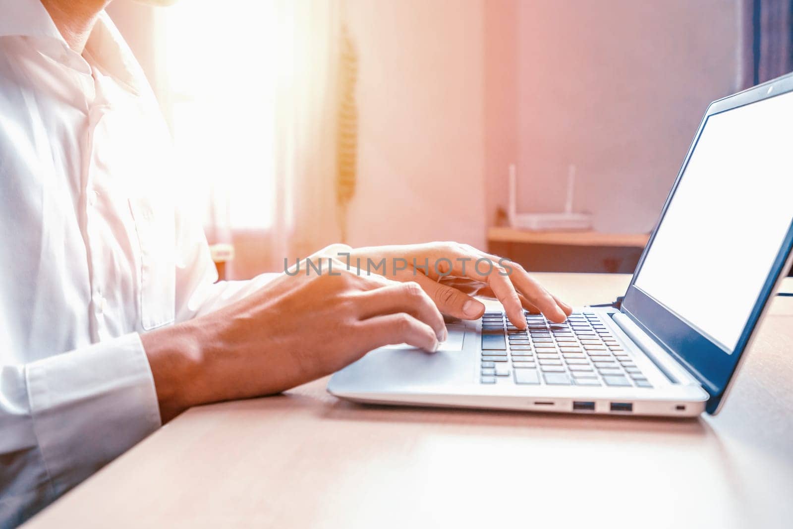 Businessman hand typing on computer keyboard of a laptop computer in office. Business and finance concept. uds