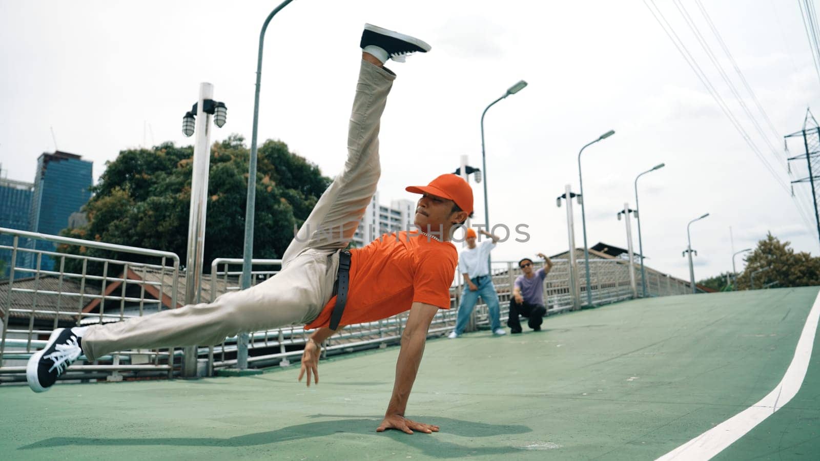 Young happy hipster perform break dancing or foot step with friend. Sprightly. by biancoblue