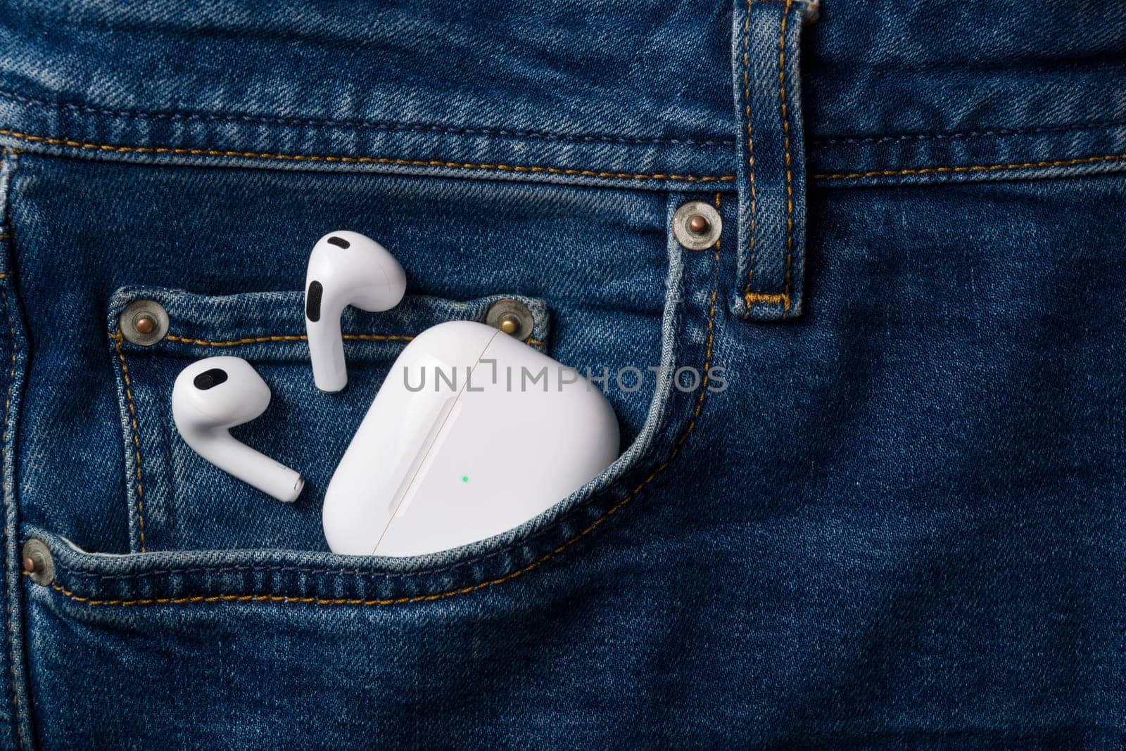 Antalya, Turkey - January 15, 2024: White wireless headphones Apple AirPods 3 by Sonat