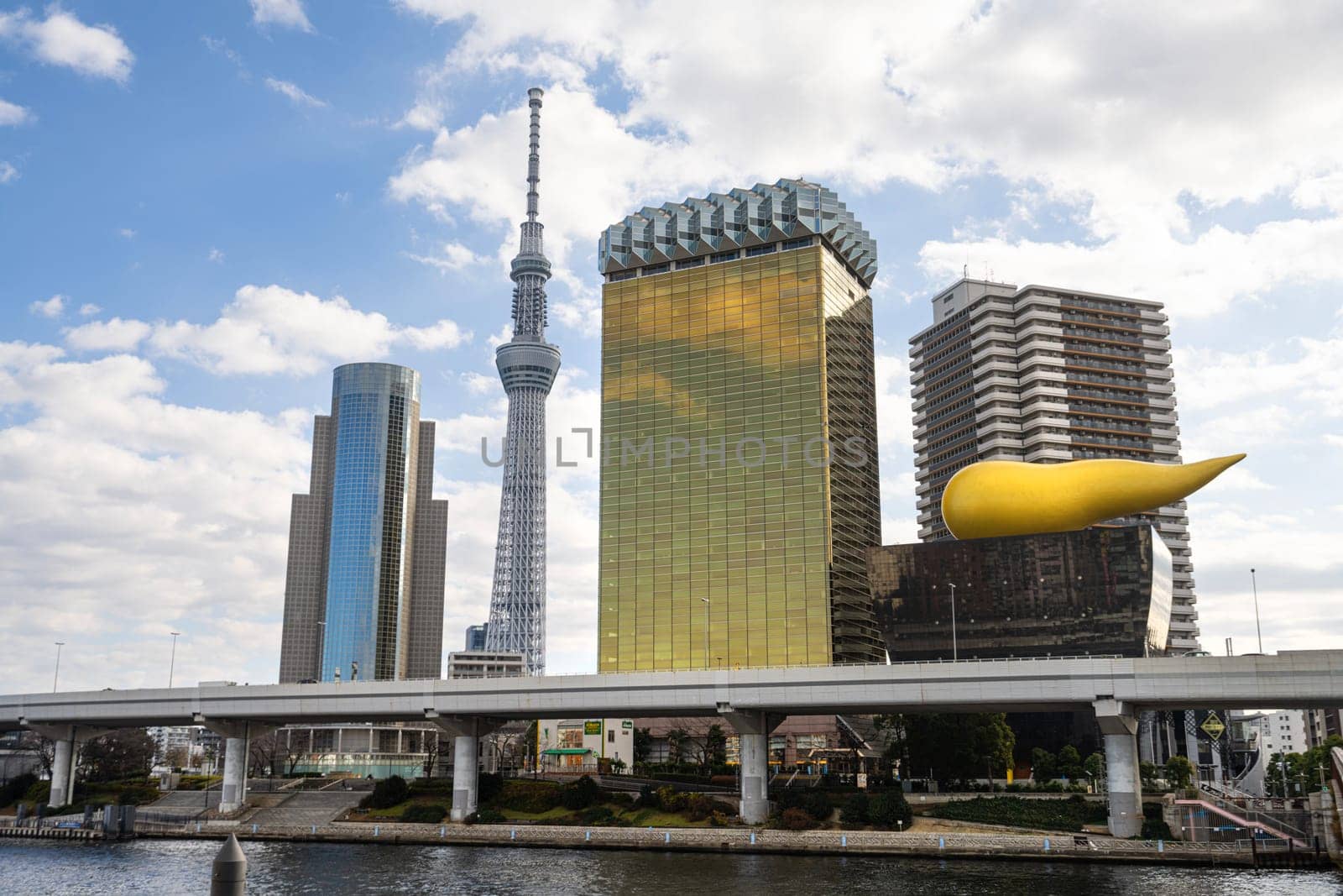 Tokyo, Japan. January 2024. panoramic view of the Asahi Group Head Office Building and the Tokyo Skytree tower in the city center
