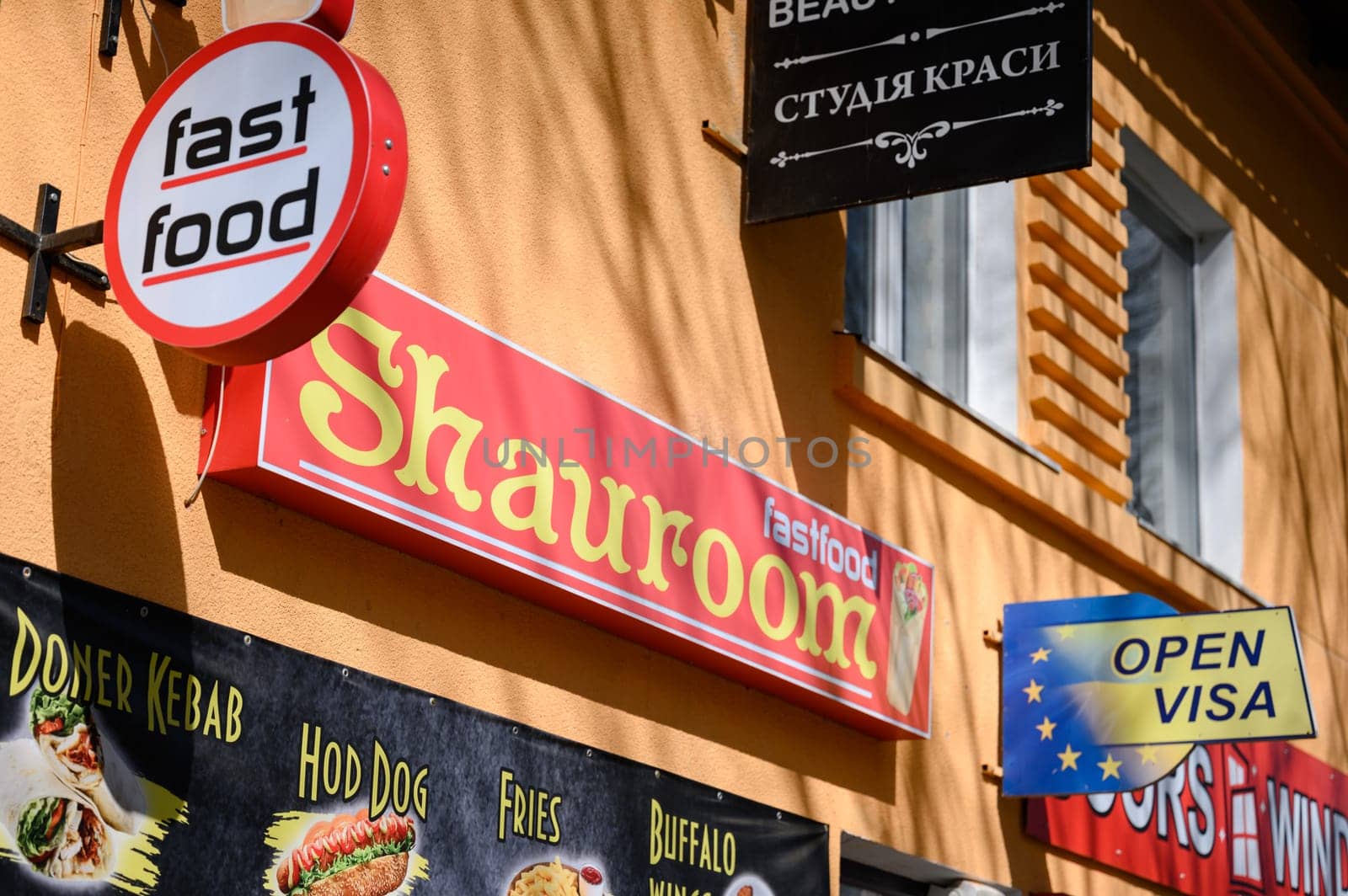 Ivano-Frankivsk, Ukraine March 26, 2023: Fast food restaurant sign on the street. by Niko_Cingaryuk