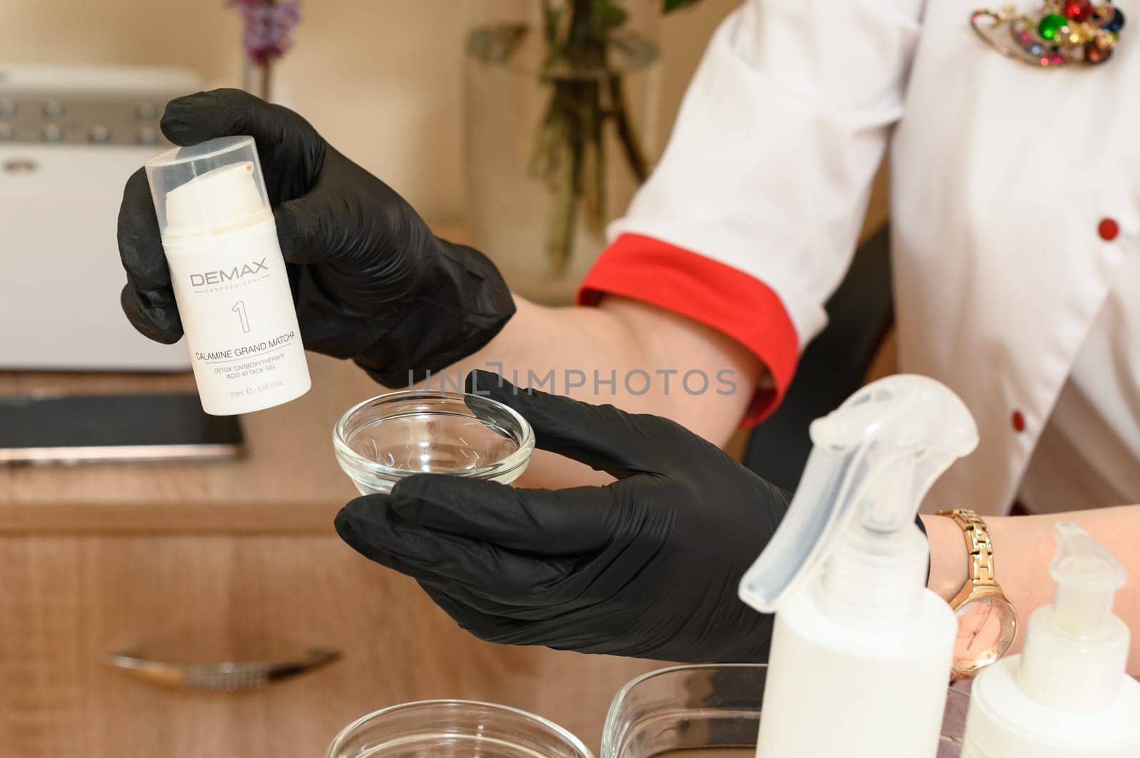 Ivano-Frankivsk, Ukraine, May 17, 2023: a cosmetologist holds a carbotherapy agent in his hands, a jar with a cosmetic agent in the hands of a cosmetologist.