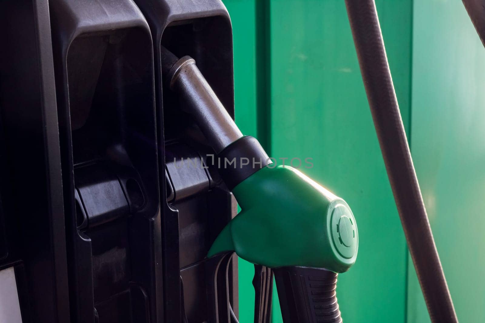 Refueling pistols at a gas station close up, copy space