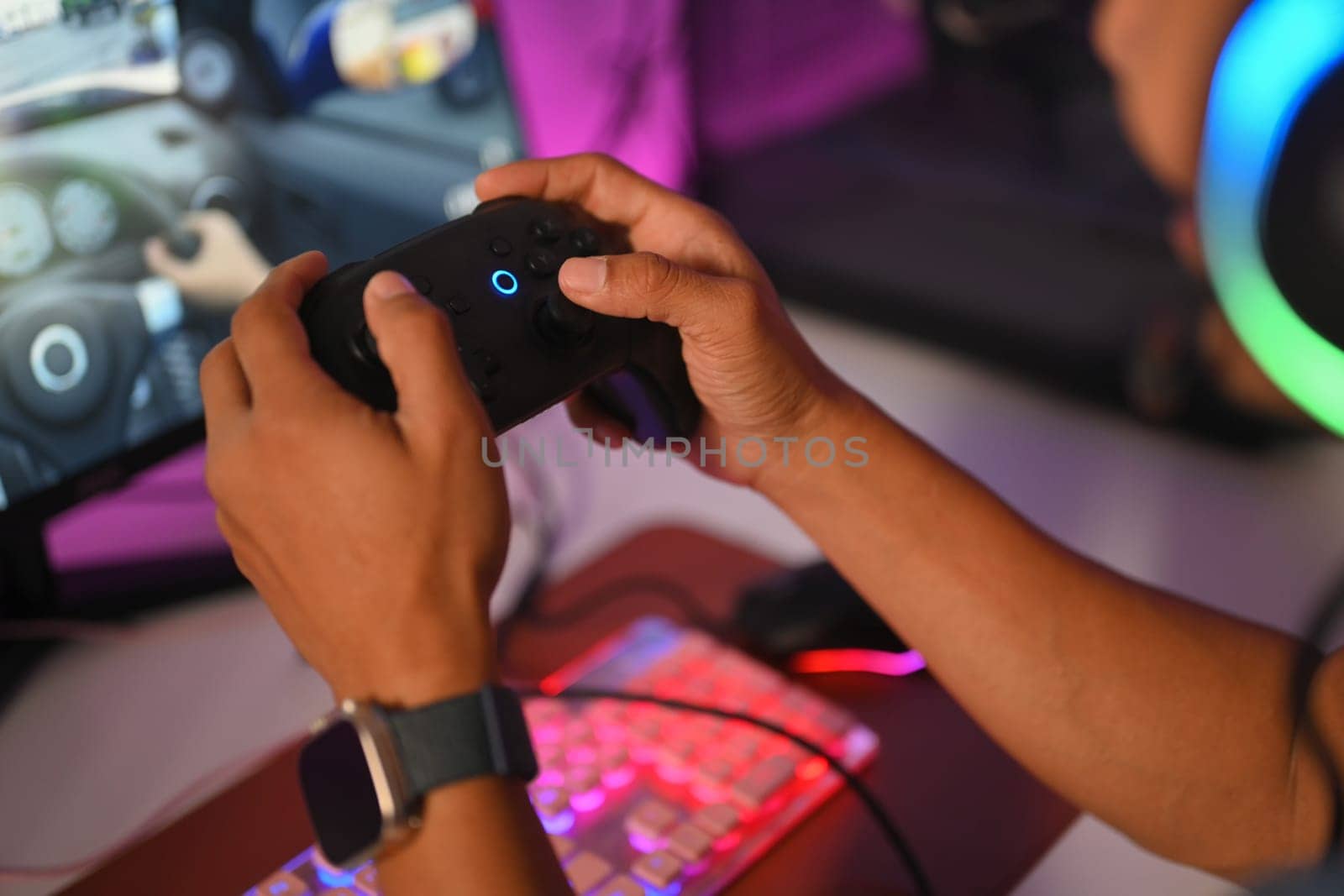 Male gamer holding joystick playing video game online. Gaming, esports and tournament concept