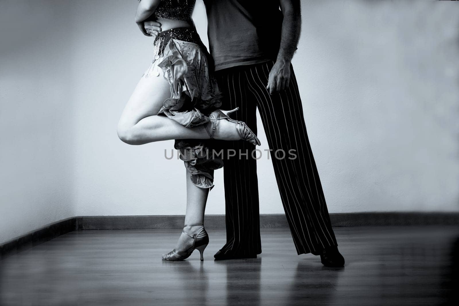 Legs of man and woman in dancing position latin dance by GemaIbarra