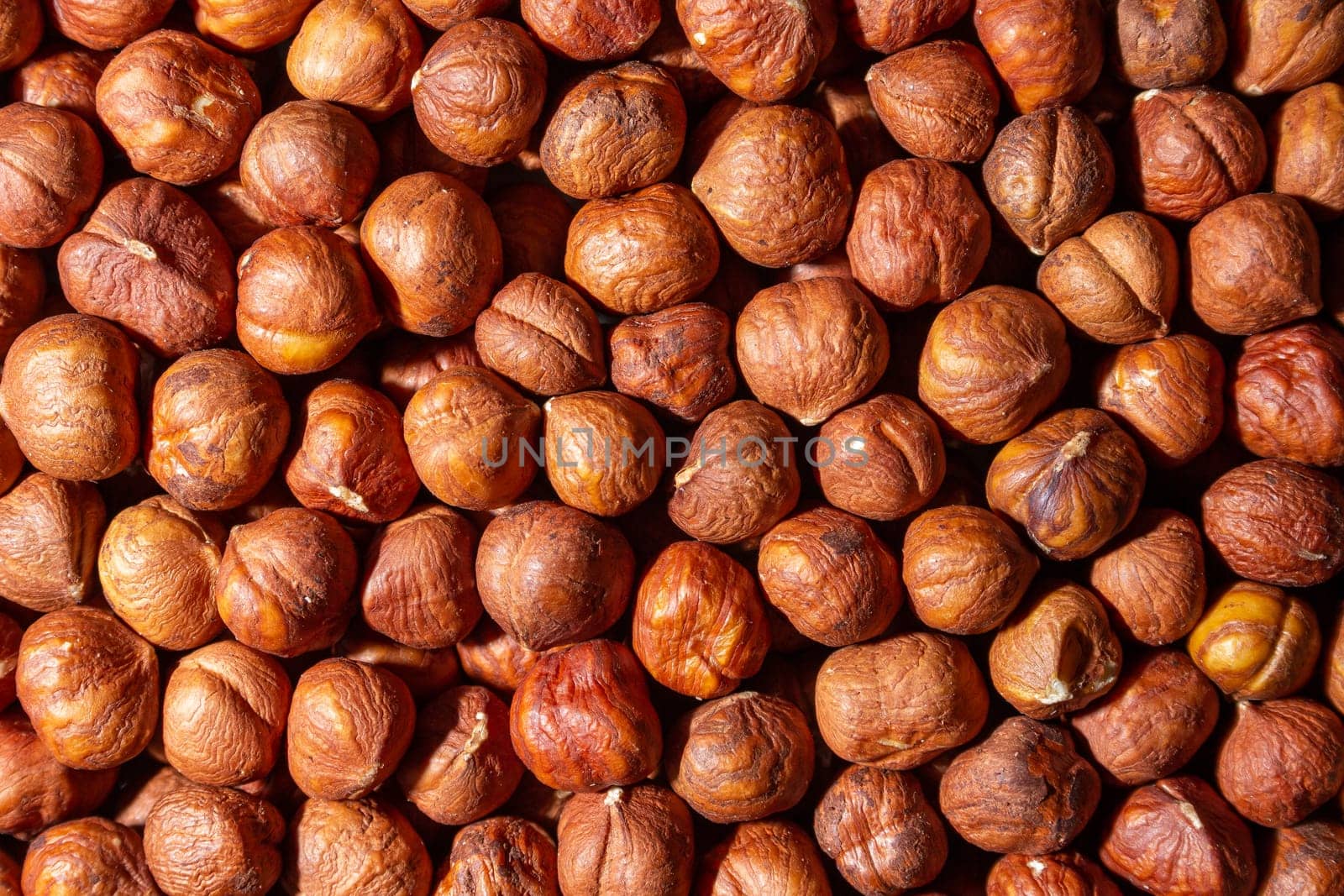 Scattered Peeled Hazelnut - Top View. Background from Hazelnuts. Natural High-Calorie Snacks