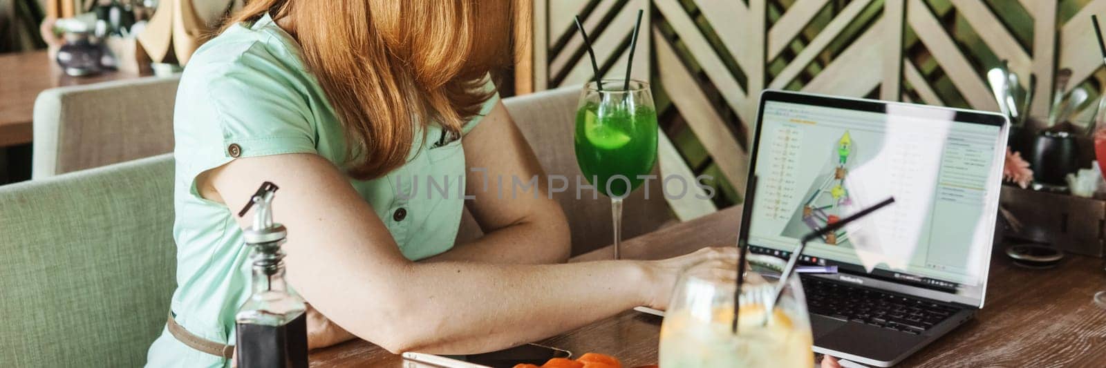 Tver, Russia-august 7, 2022. A woman with a laptop is studying human design. The concept of studying esoteric sciences. Studying rave postcards from human design by Annu1tochka