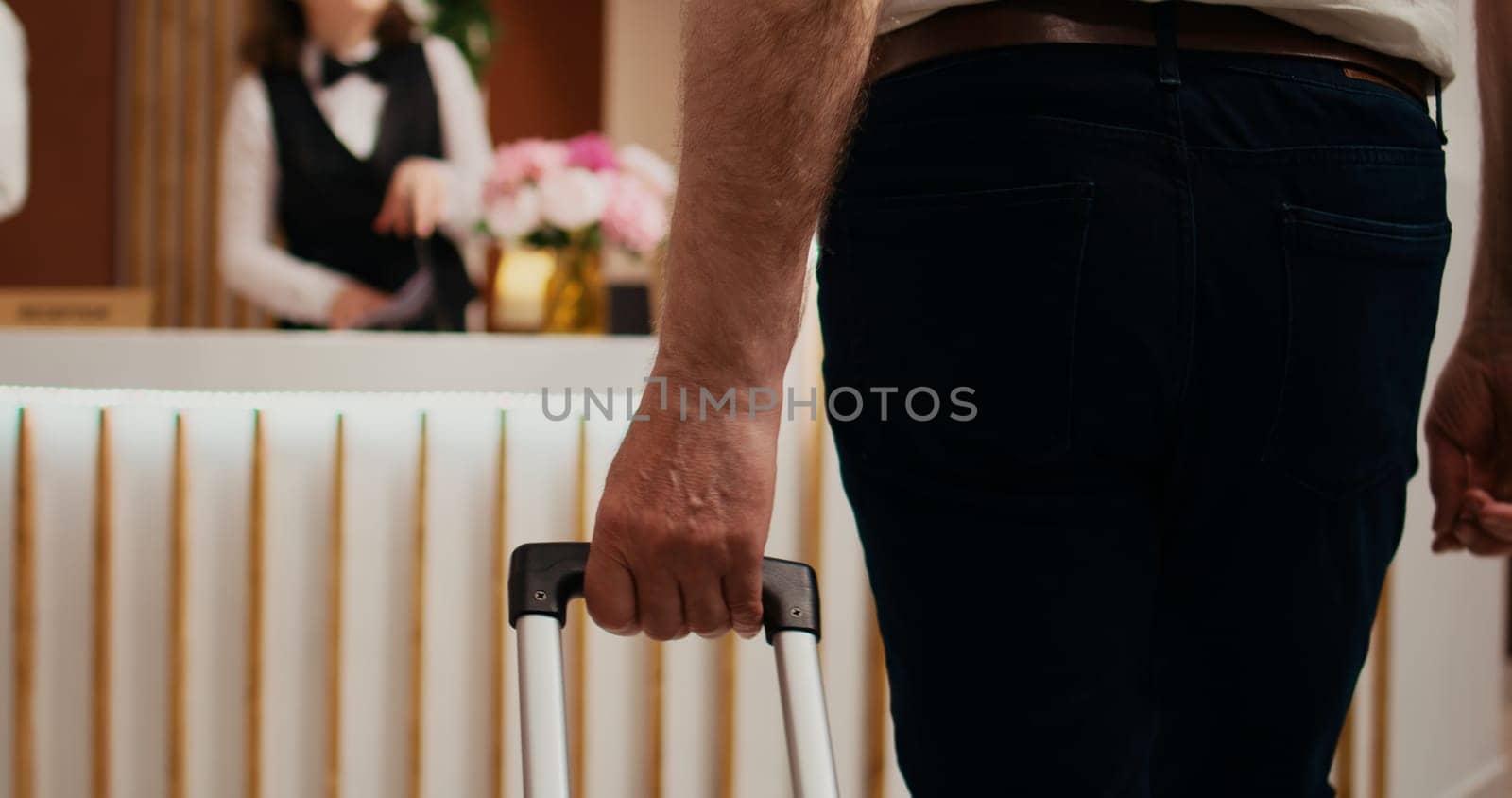 Retired person approaching front desk by DCStudio