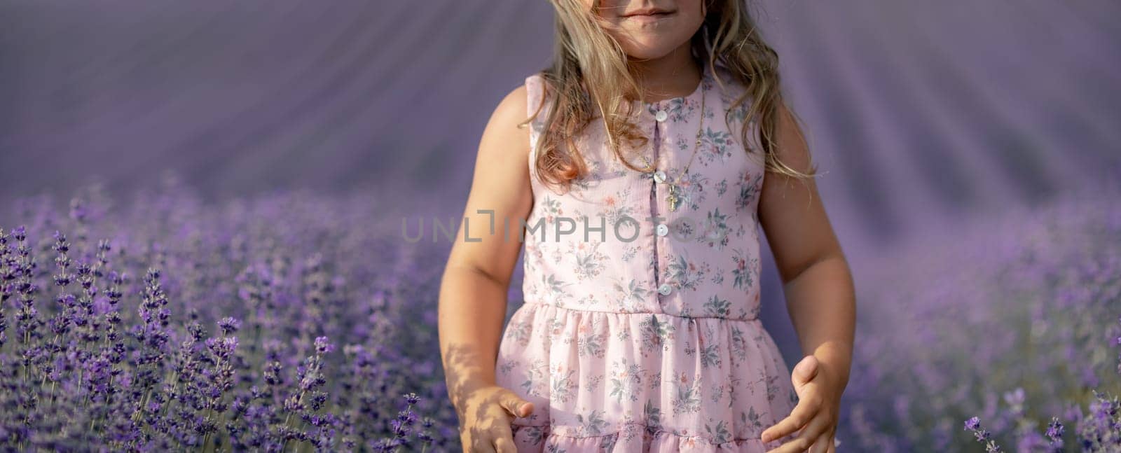 Lavender field girl. happy girl in pink dress in a lilac field of lavender. Aromatherapy concept, lavender oil, photo session in lavender.