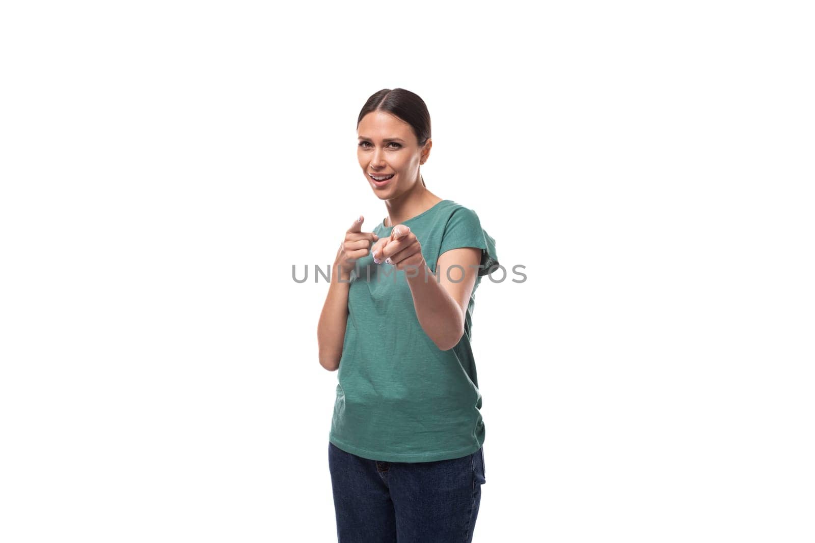 young slim woman dressed in a green basic t-shirt with branding print space.