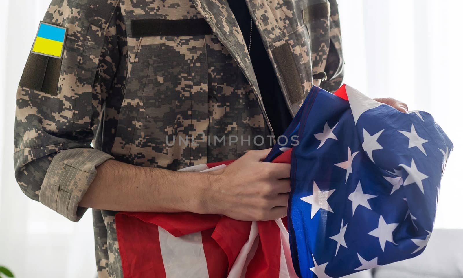 Ukrainian military man with USA flag.