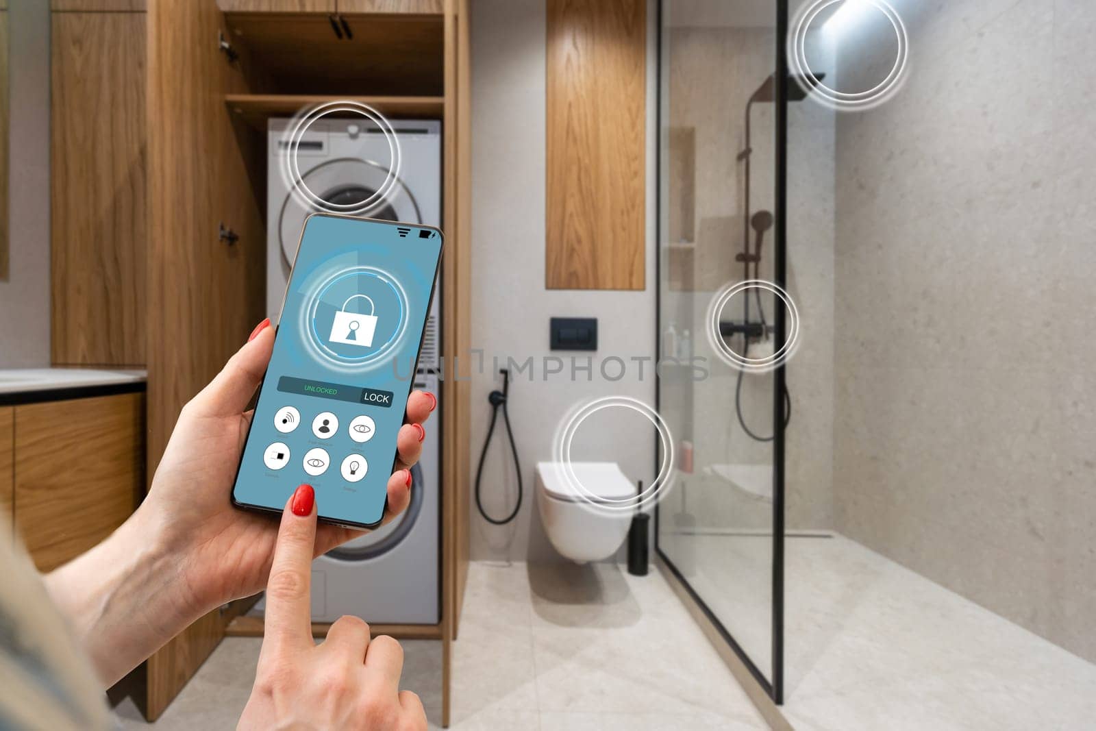 smart house, home automation, device with app icons. woman uses his smartphone with smarthome security app to unlock the door of his house