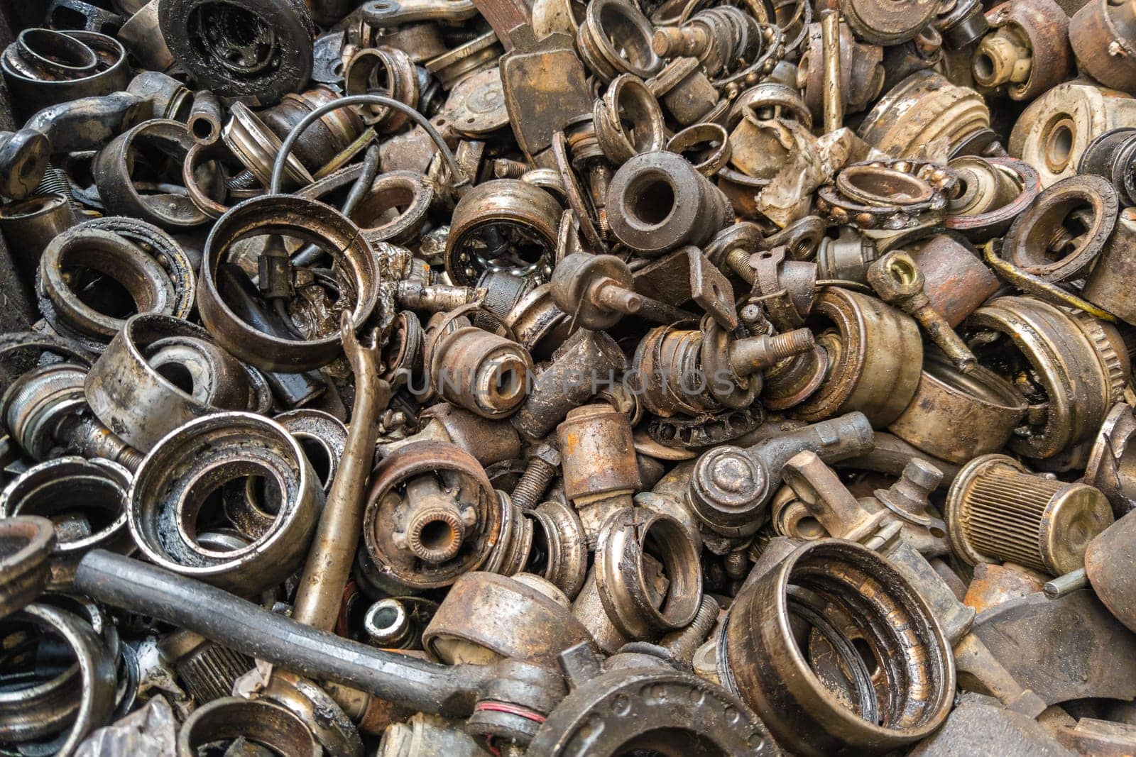 rusted steel scrap pile of used car parts and pieces by z1b