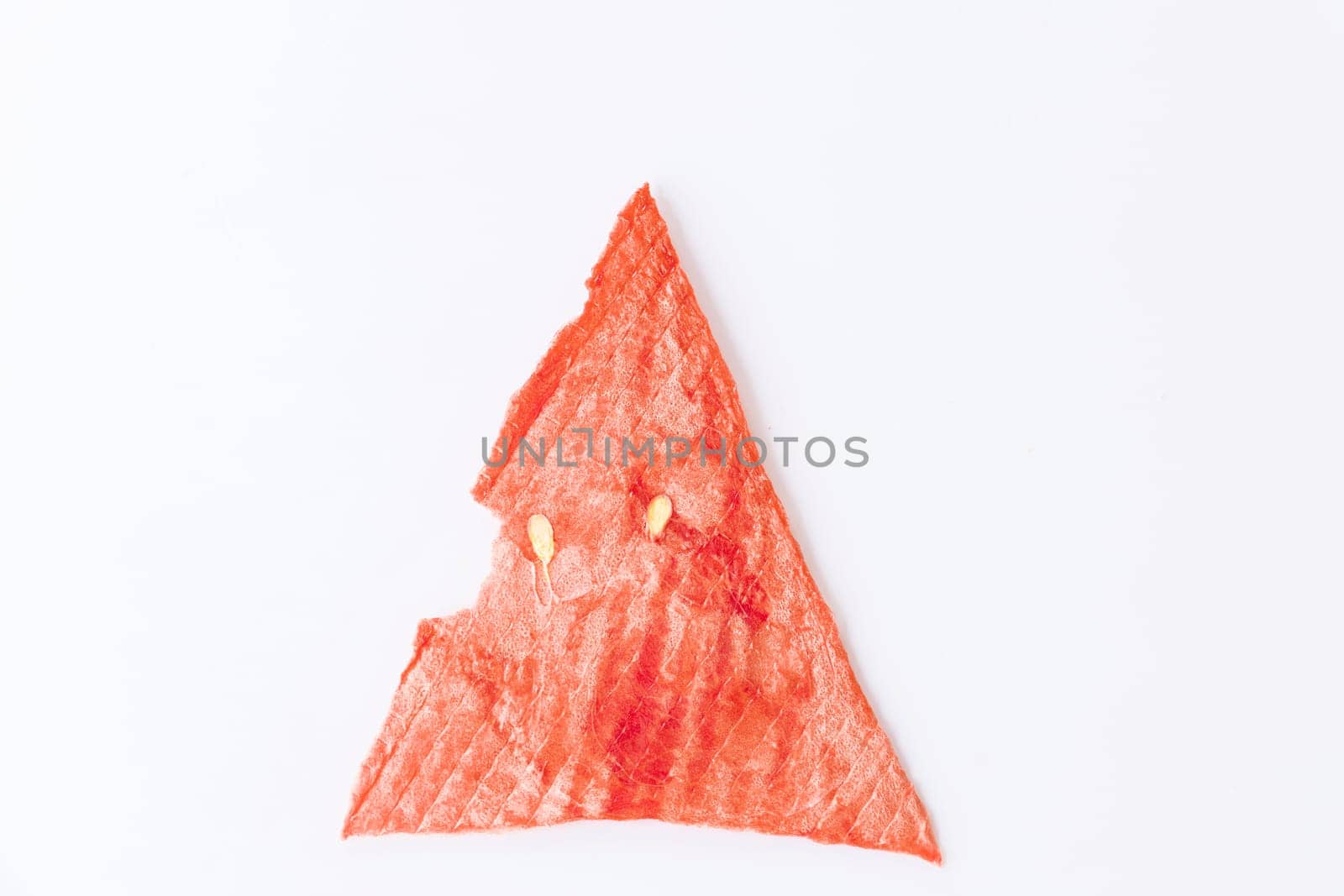 triangular slice of dried red, ripe watermelon. fruit chips on white background. healthy sweets concept, diet, isolate by Leoschka
